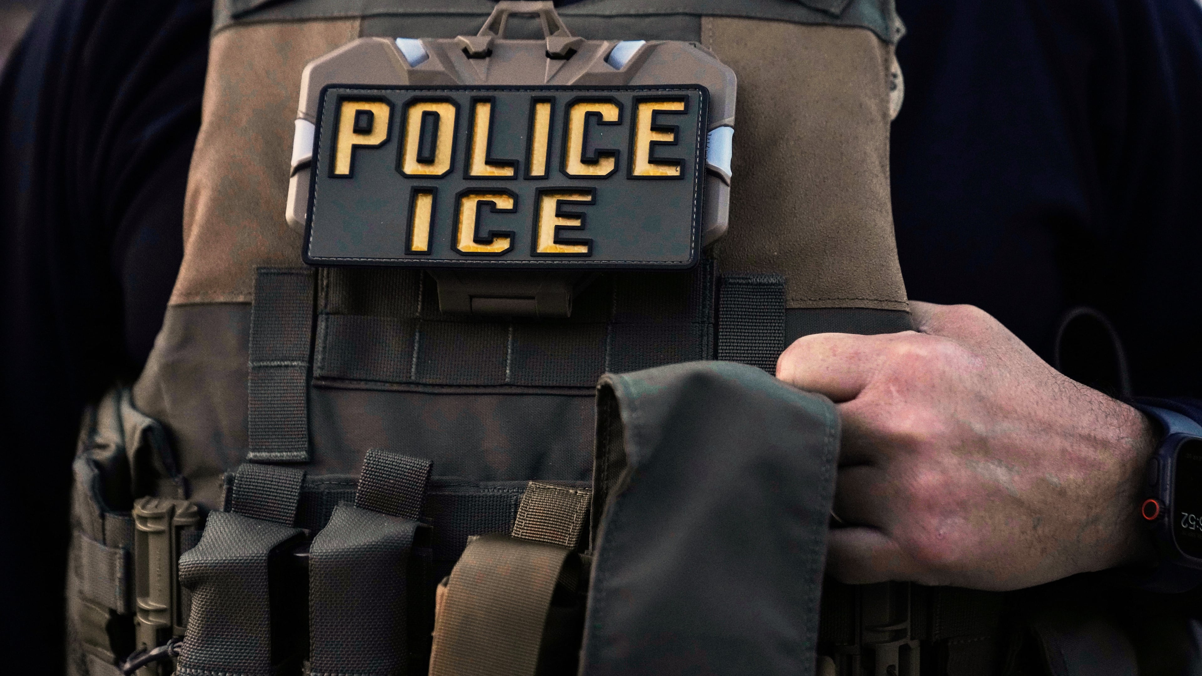 FILE - A U.S. Immigration and Customs Enforcement agent is seen in Park Ridge, Ill., Sept. 19, 2025. (AP Photo/Erin Hooley, File)