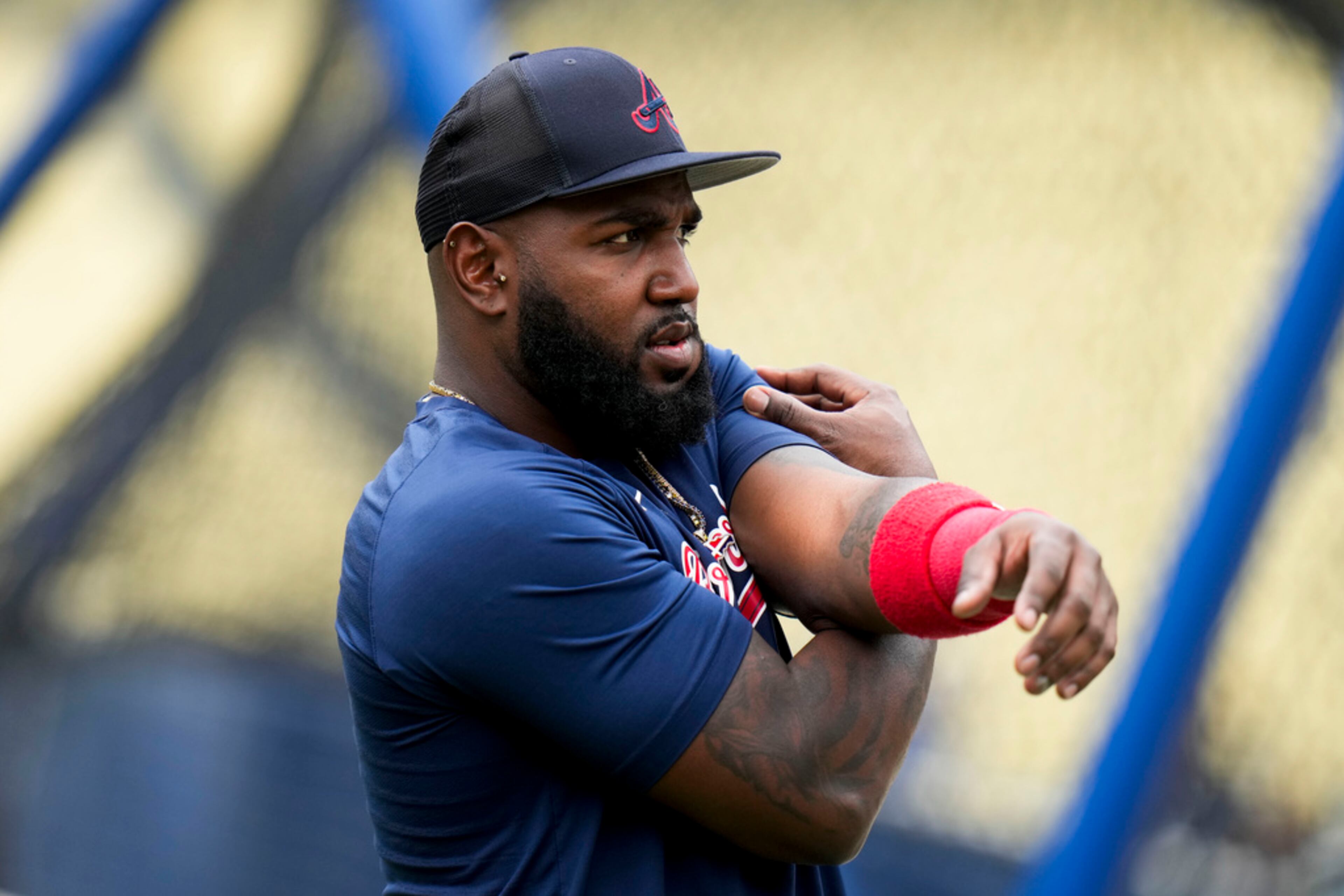 Atlanta Braves' Marcell Ozuna stretches during practice for the team's baseball game against the Los Angeles Dodgers Saturday, Sept. 2, 2023, in Los Angeles. (AP Photo/Jae C. Hong)