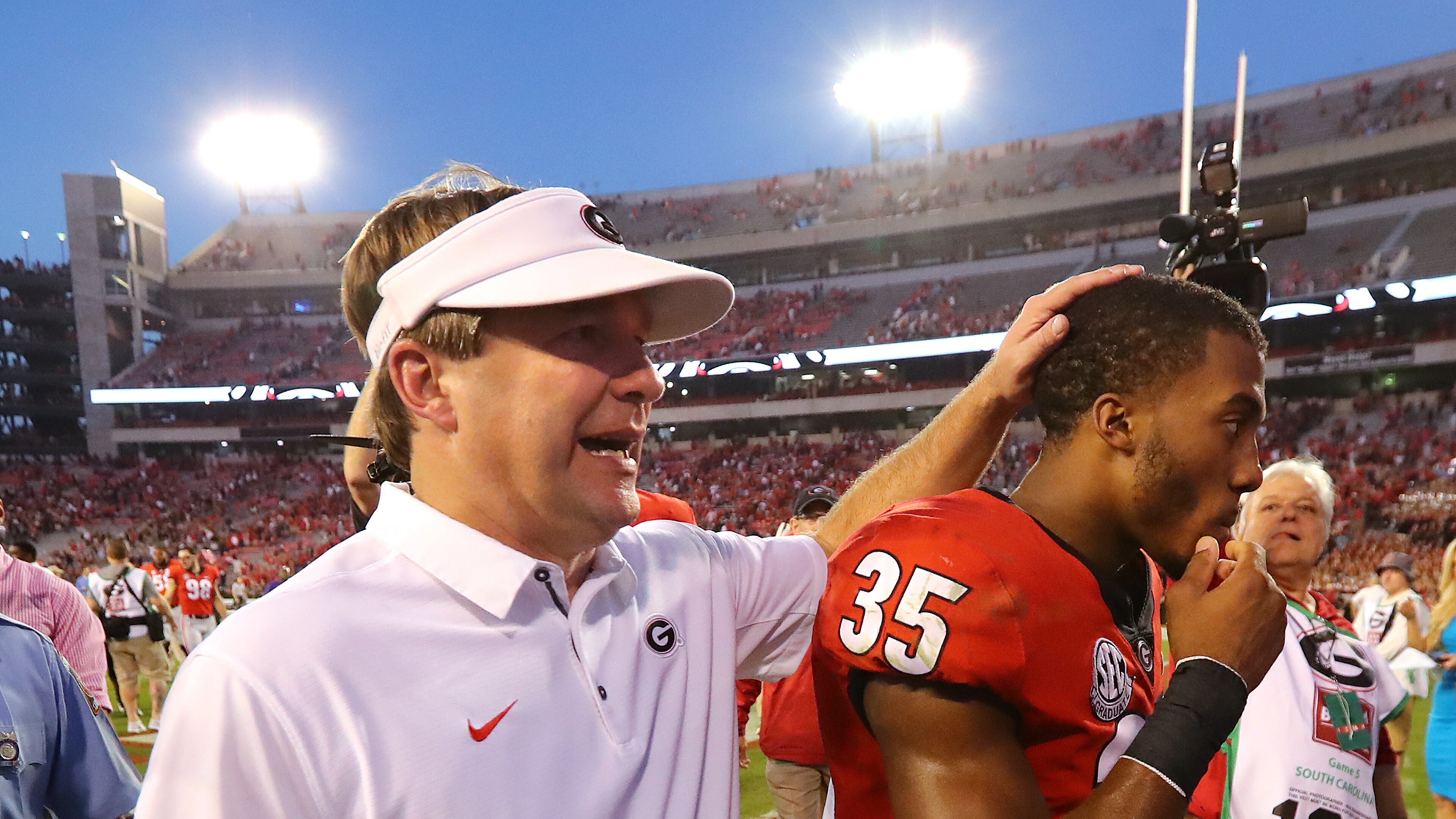 Georgia coach Kirby Smart gives Brian Herrien a pat on the head after the Bulldogs beat South Carolina.