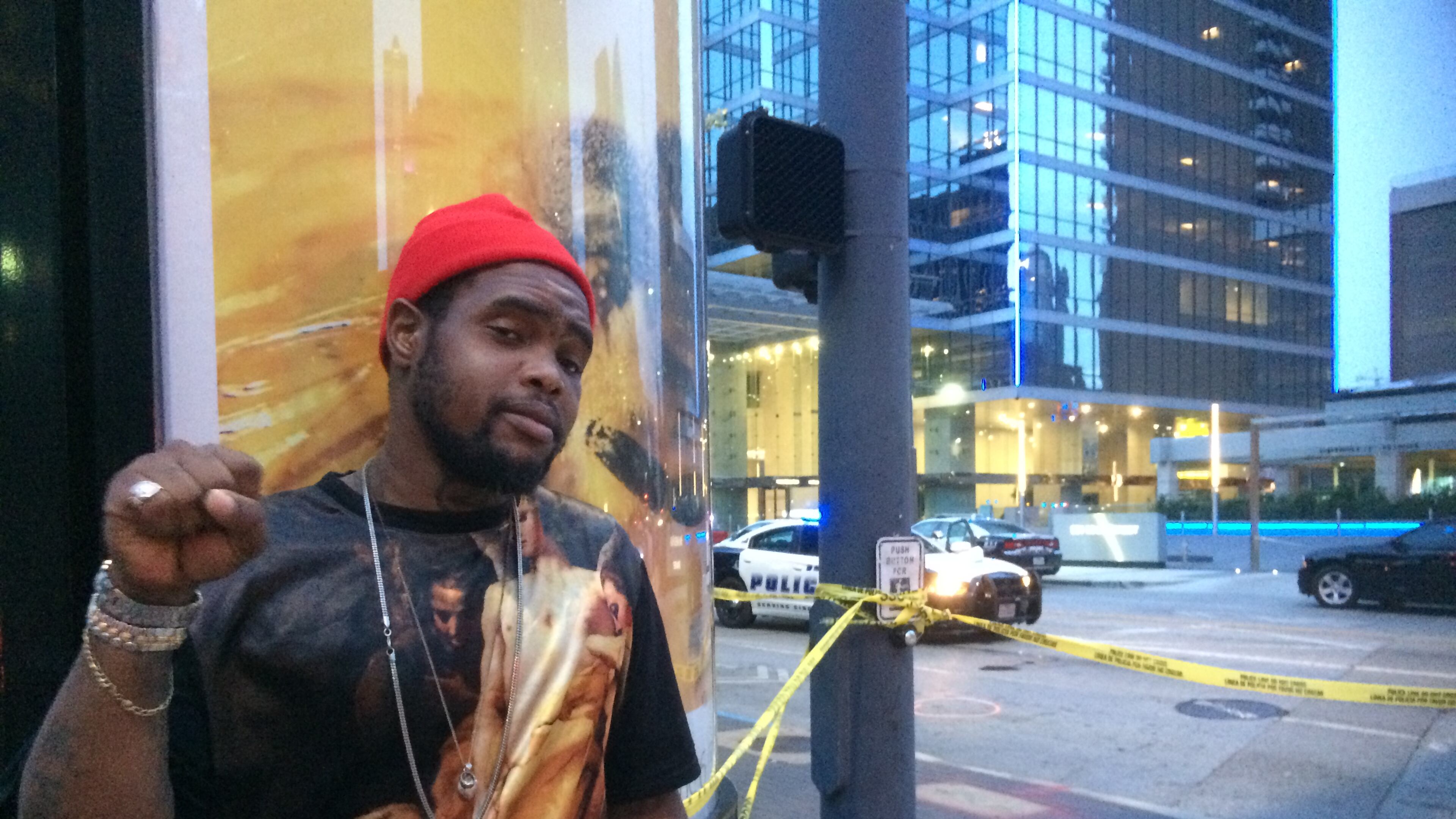 Keon Collins does not condone the sniper attacks but walked past police officers with his middle finger raised as a statement against police brutality in general. Photo: Jennifer Brett