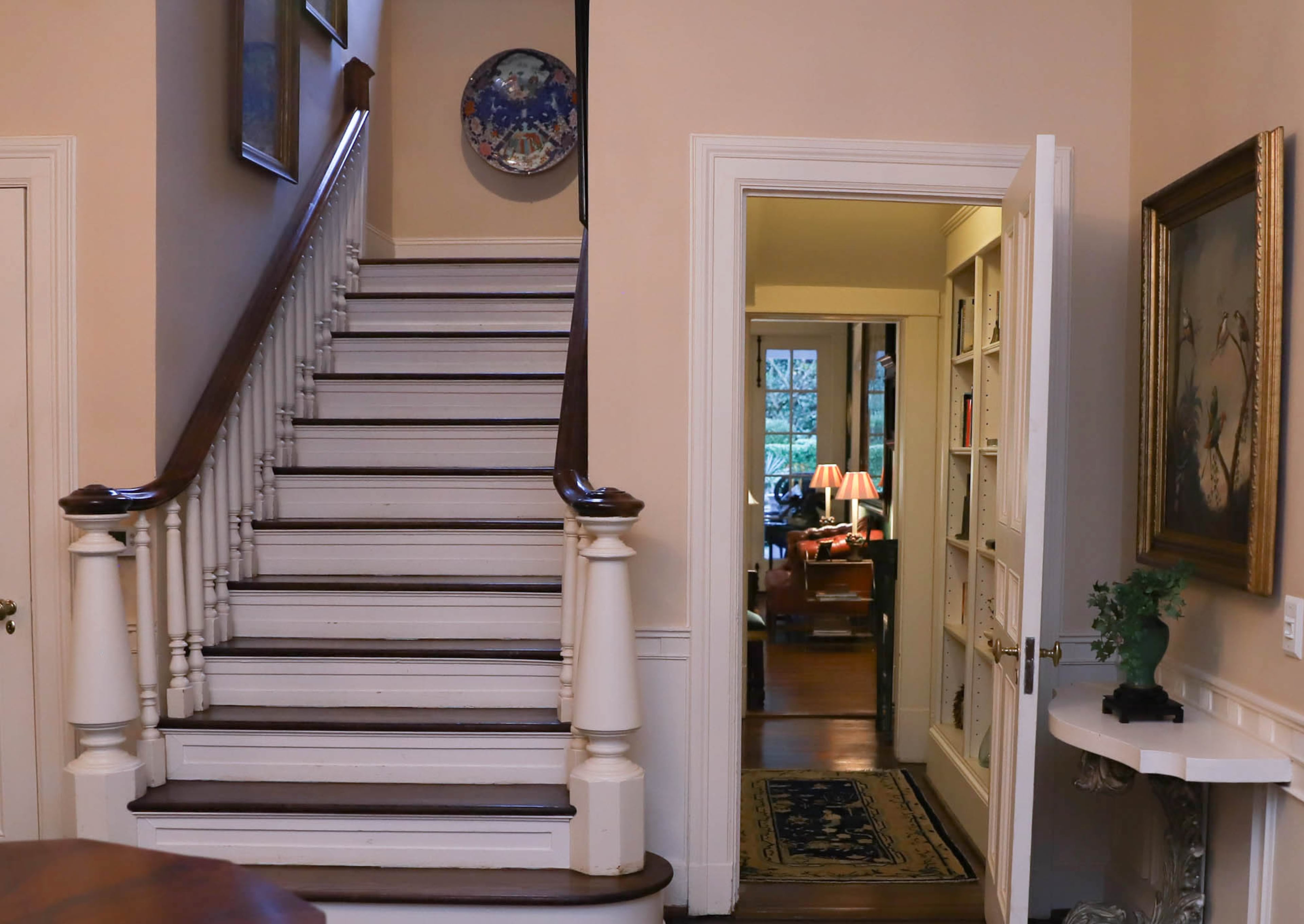 An Imari porcelain charger in the stairwell is one of the couple's favorite collected items in their home. They purchased it in New Orleans. Text by Lori Johnston/Fast Copy News Service.