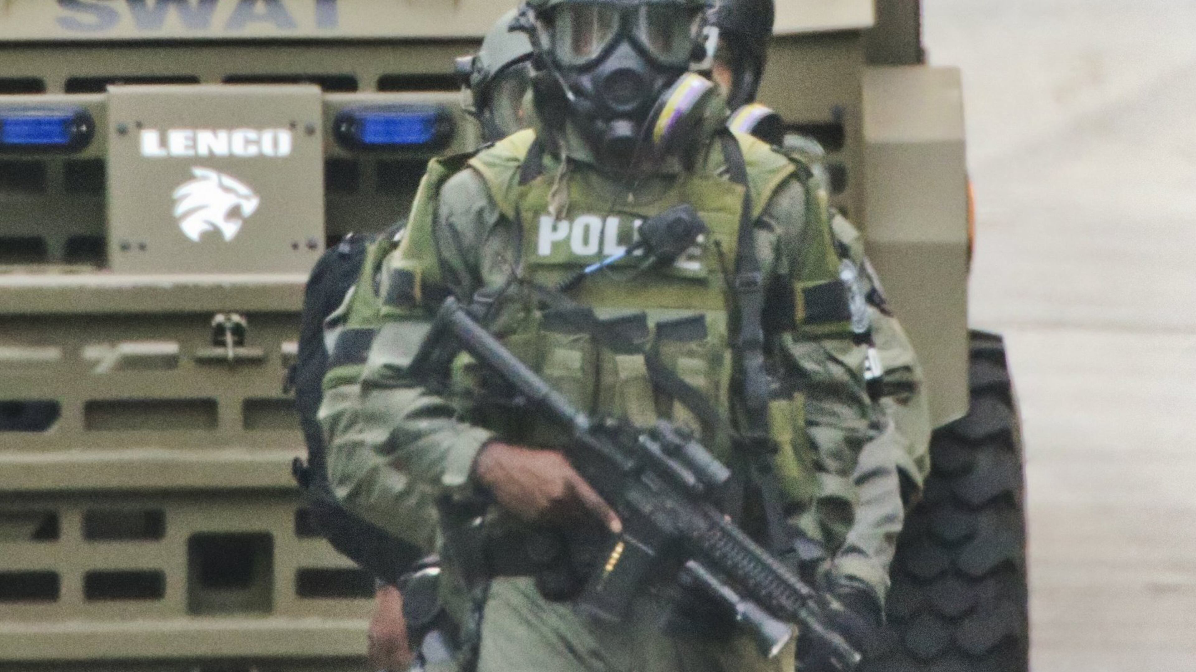 Atlanta police surrounded a home in southwest Atlanta — Zone 3 for city police — for several hours in June, but when SWAT officers went into the house, the person whey were looking for was not there. They did recover three rifles and a revolver. JOHN SPINK/JSPINK@AJC.COM