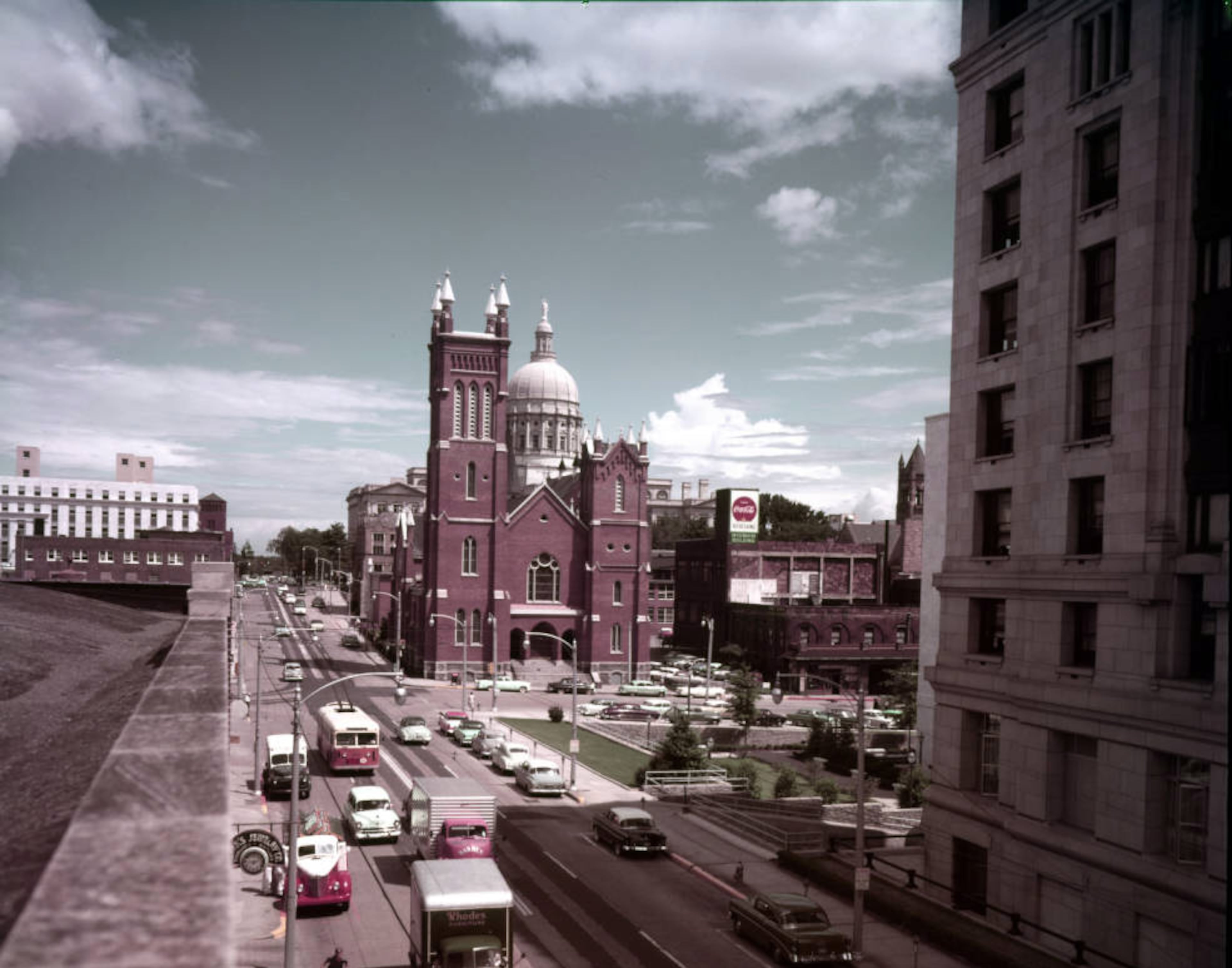 A color shot of the Church of the Immaculate Conception with the State Capitol in the background from August 1956.