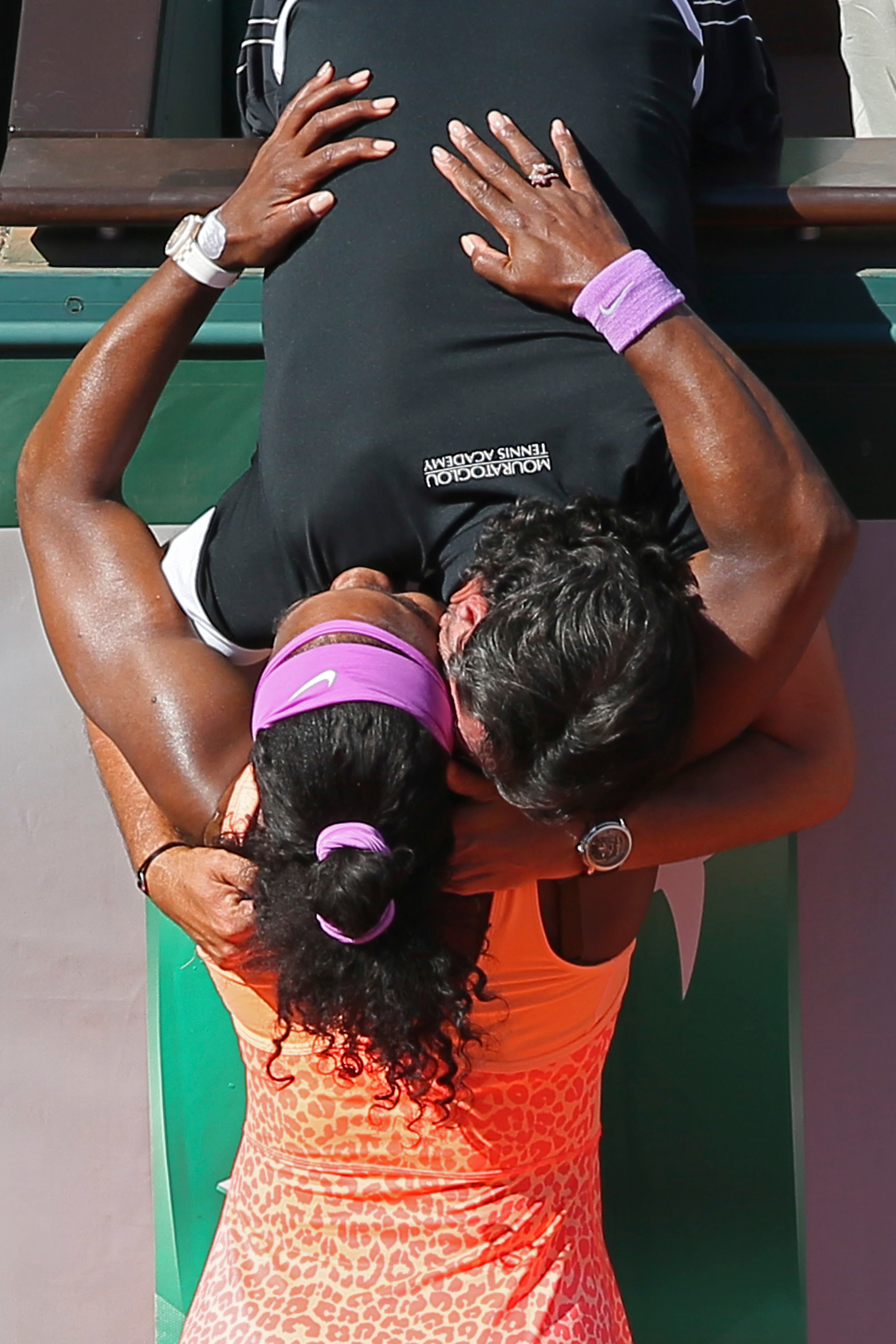 Serena Williams of the U.S. hugs her coach Patrick Mouratoglou of France after winning the final of the French Open tennis tournament against Lucie Safarova of the Czech Republic in three sets, 6-3, 6-7, 6-2, at the Roland Garros stadium, in Paris, France, Saturday, June 6, 2015. (AP Photo/David Vincent)