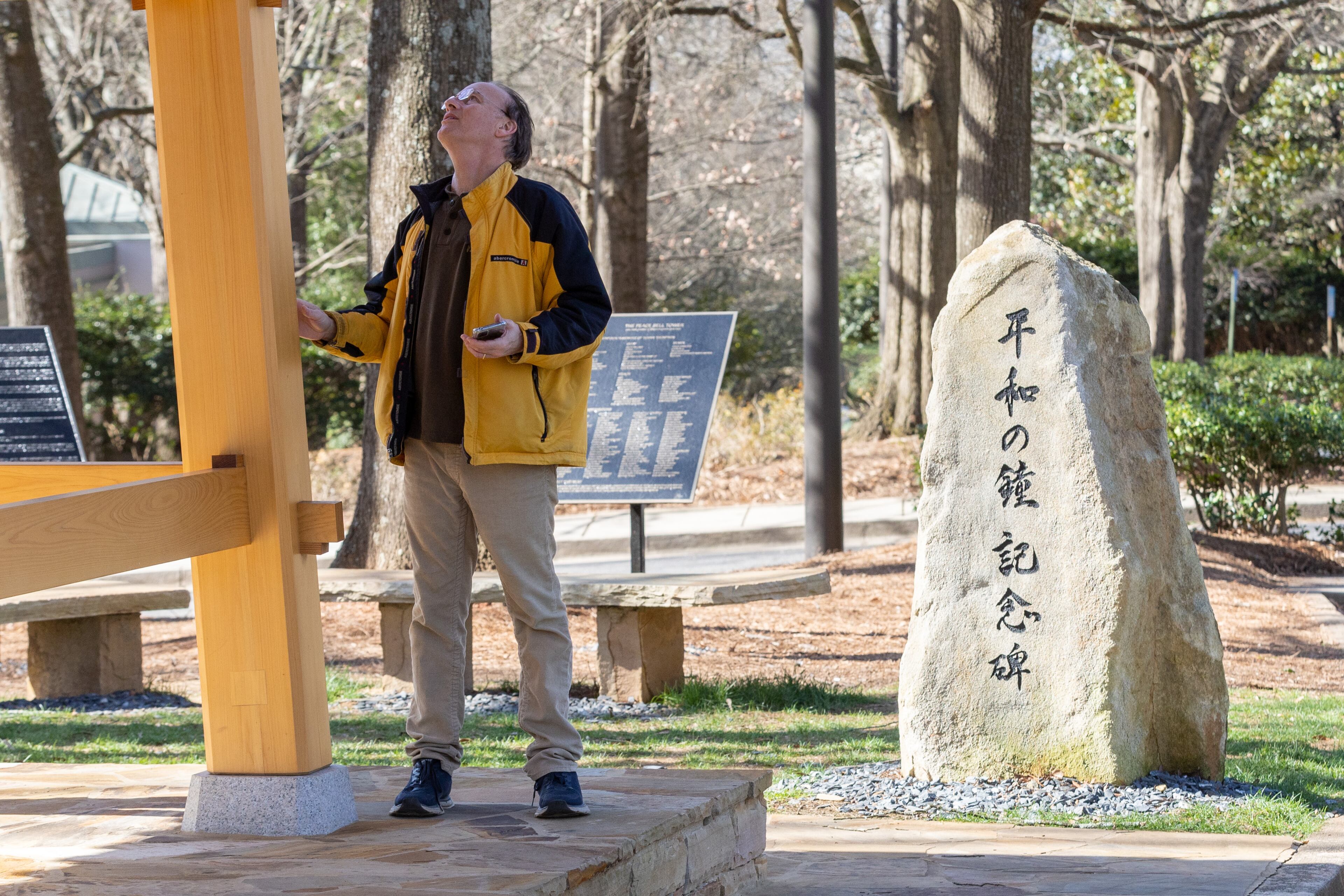 Mike Perez looks over the Peace Bell at the the Carter Center in Atlanta on Sunday morning, Feb. 19, 2023. (Photo: Steve Schaefer / steve.schaefer@ajc.com)