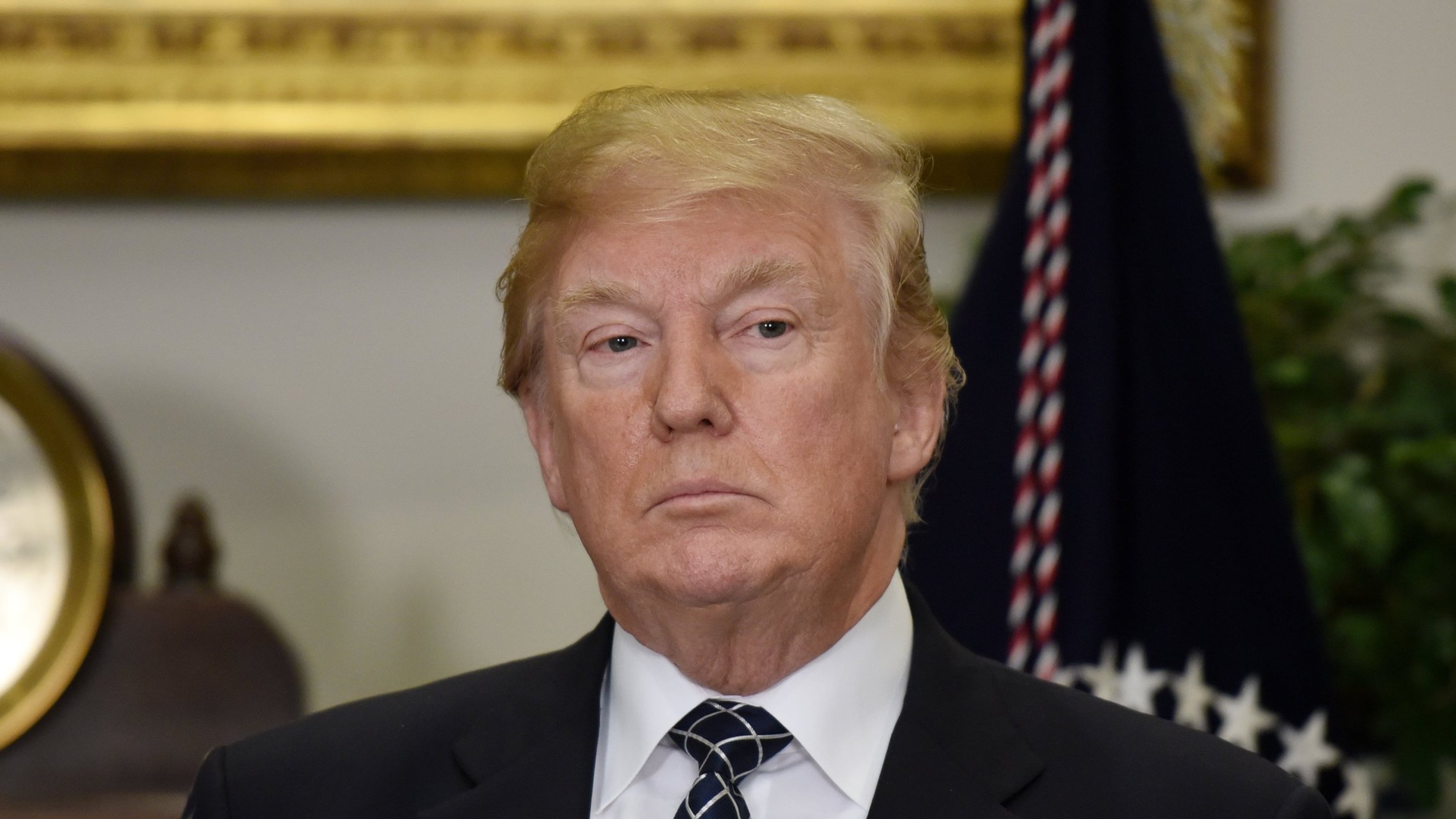 President Donald Trump looks on before signing a proclamation to honor Martin Luther King Jr. Day during a event Friday in the Roosevelt Room of the White House. Trump is under fire after reports he used a derogatory phrase to refer to Haiti and African countries. OLIVIER DOULIERY / ABACA PRESS / TNS