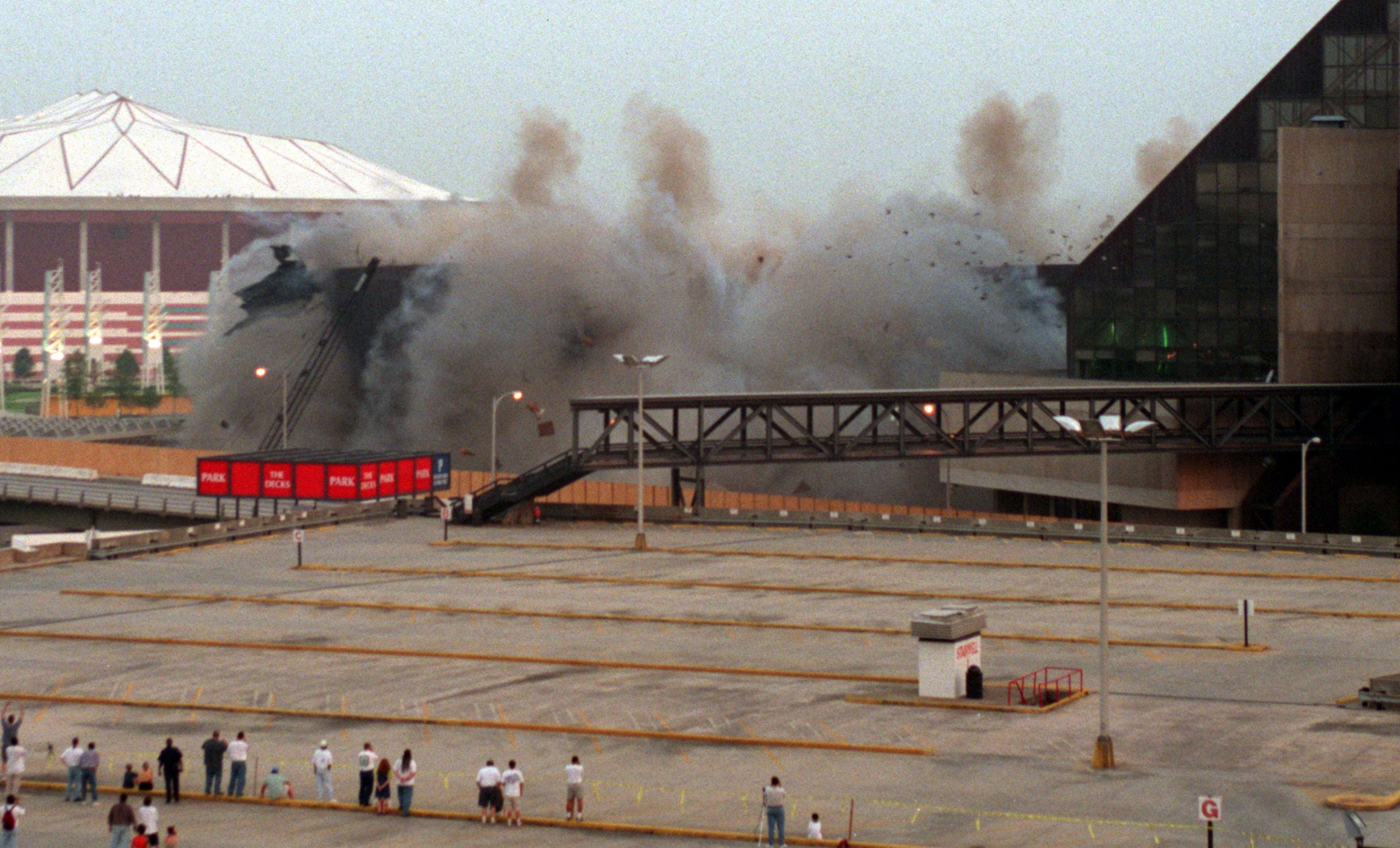 970726 - Atlanta, Georgia - OMNI IMPLOSION -- Debris, dust and smoke fly into the air as the walls and roof of The Omni collapse to the ground during the implosion process. The Omni is being demolished to make way for a new downtown arena. (AJC Staff Photo/Jean Shifrin)
