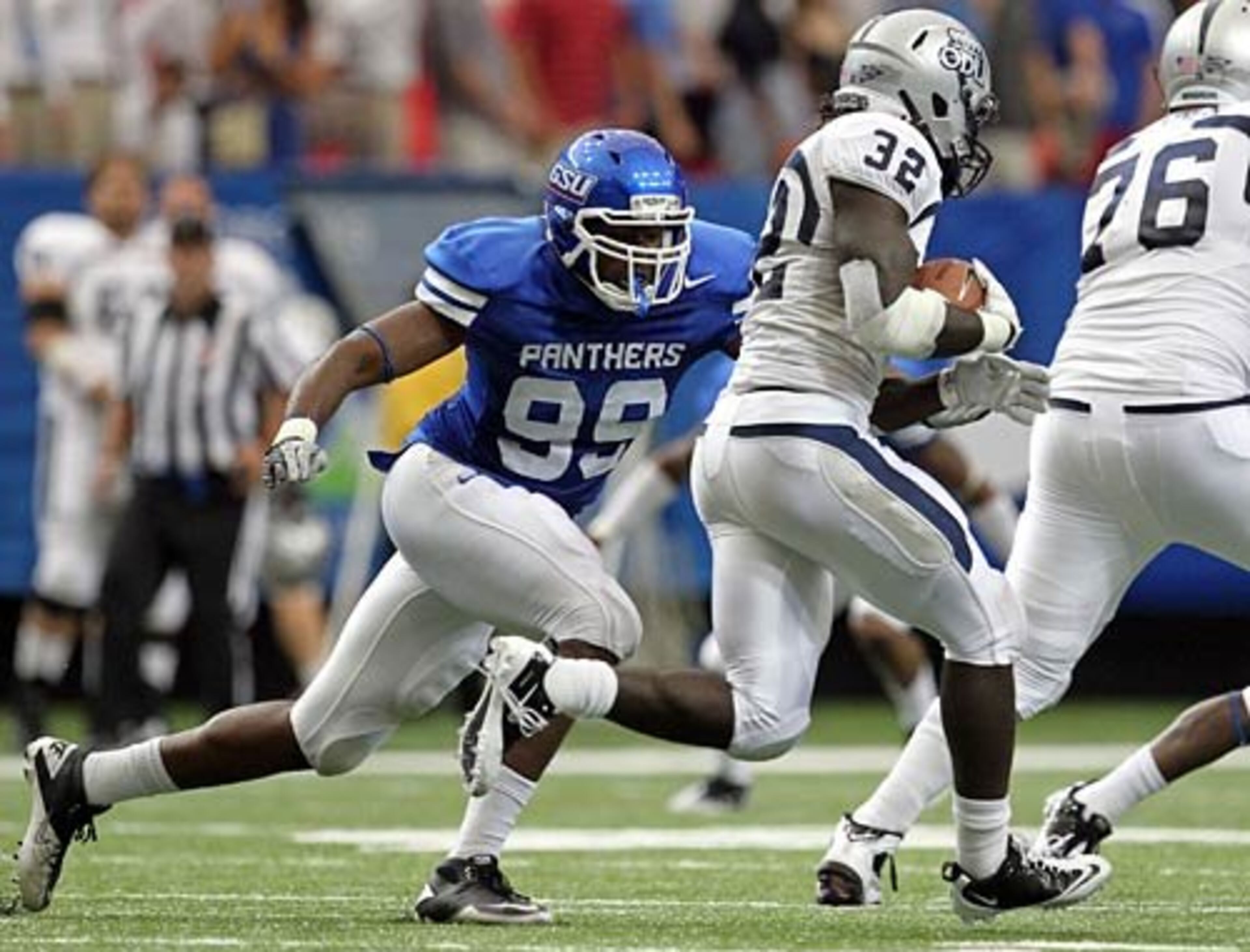 GSU defensive end A.J. Portee (99) tackles Old Dominion running back Angus Harper (32) for a short gain.
