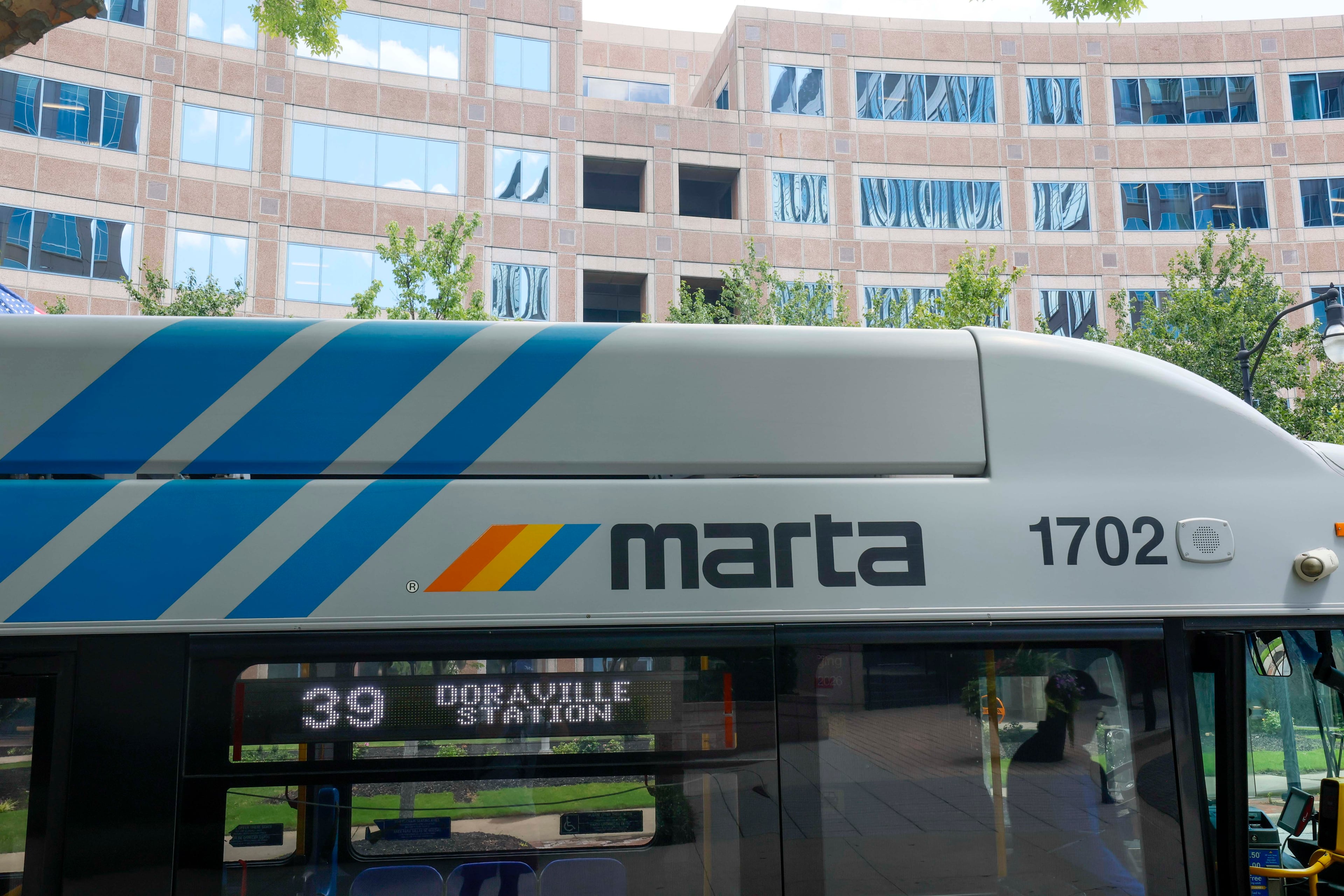 A MARTA bus is seen in front of the MARTA headquarters building in Atlanta last week. (Miguel Martinez/AJC)