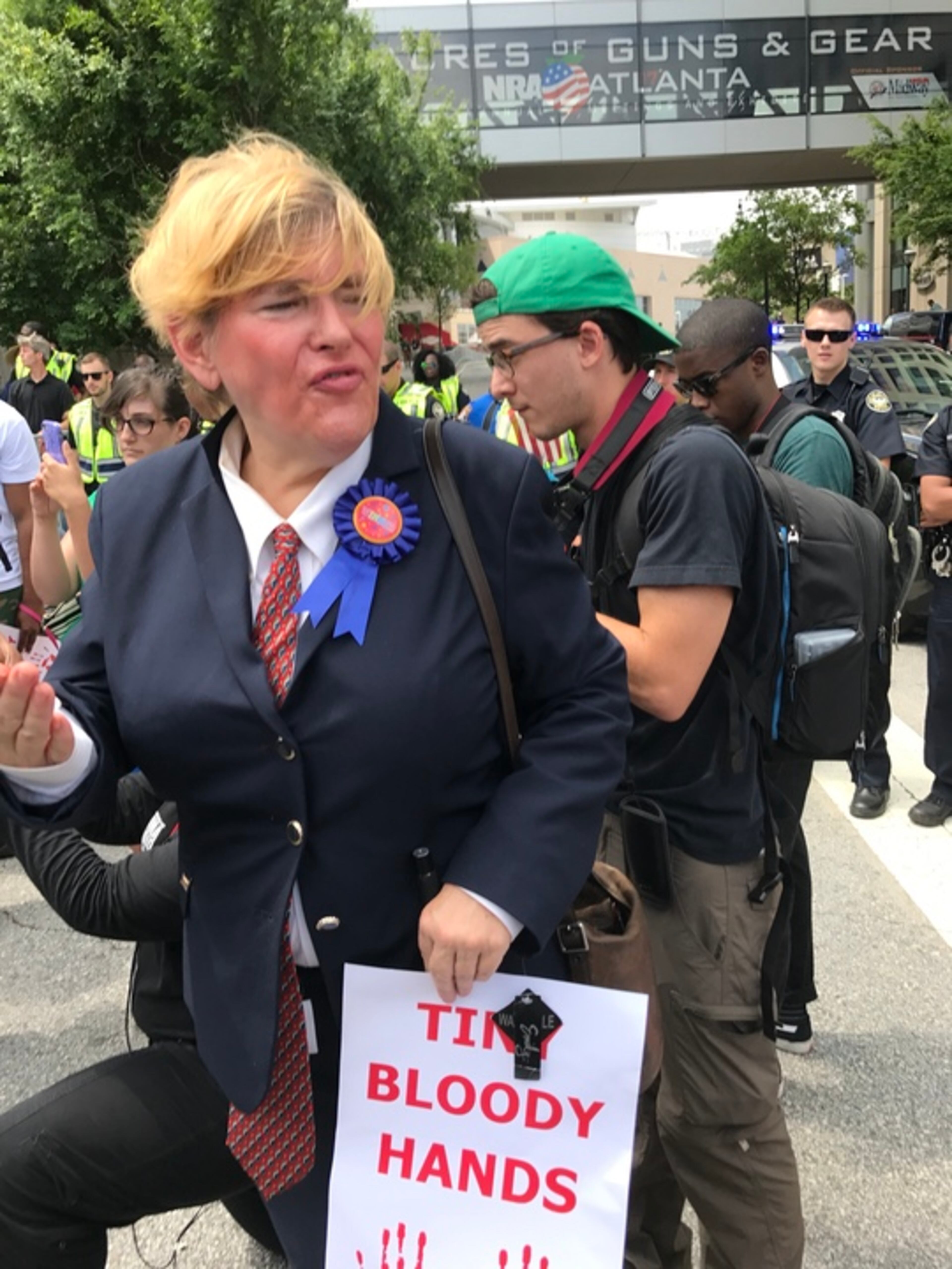 Priscilla Smith, a.k.a. "the real Donna J. Trump" joined protesters demonstrating against President Trump, who was in town to deliver a speech at the National Rifle Association convention.
