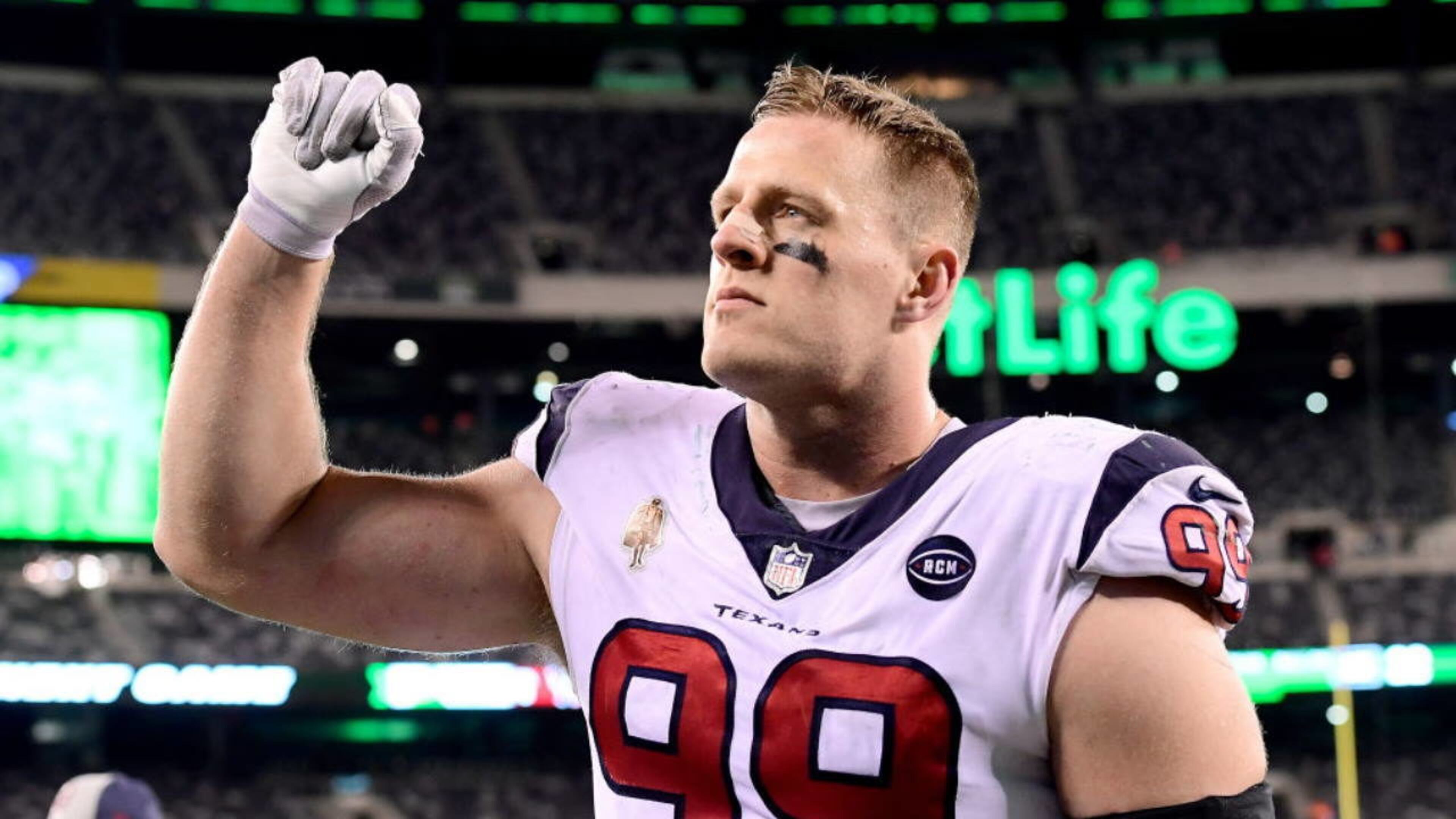 Texans defensive star J.J. Watt was too big for a child's bicycle as he tried to pedal it across a Green Bay street during a Packers' longtime fan tradition.