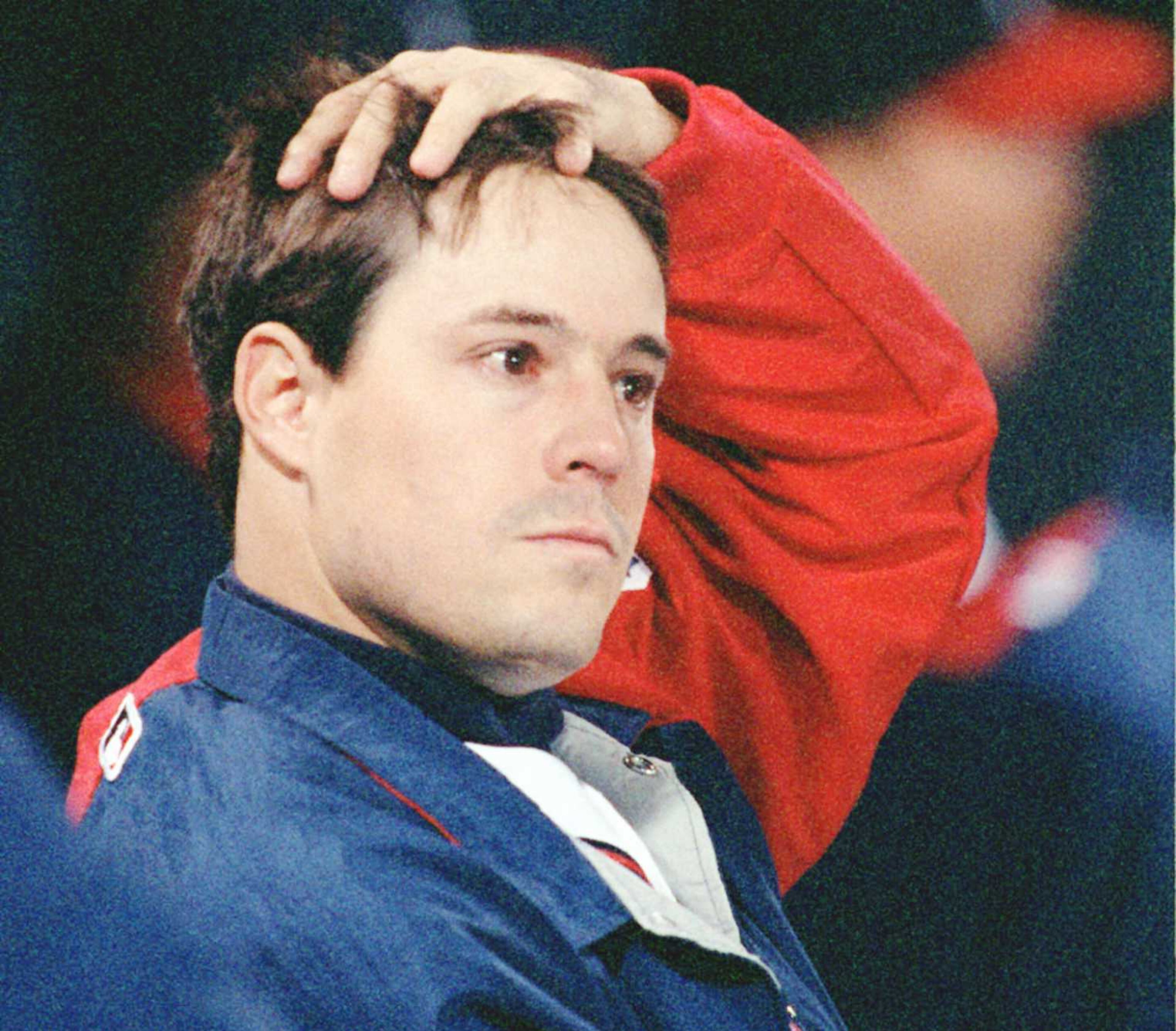 Greg Maddux on the bench between innings late in game 1.