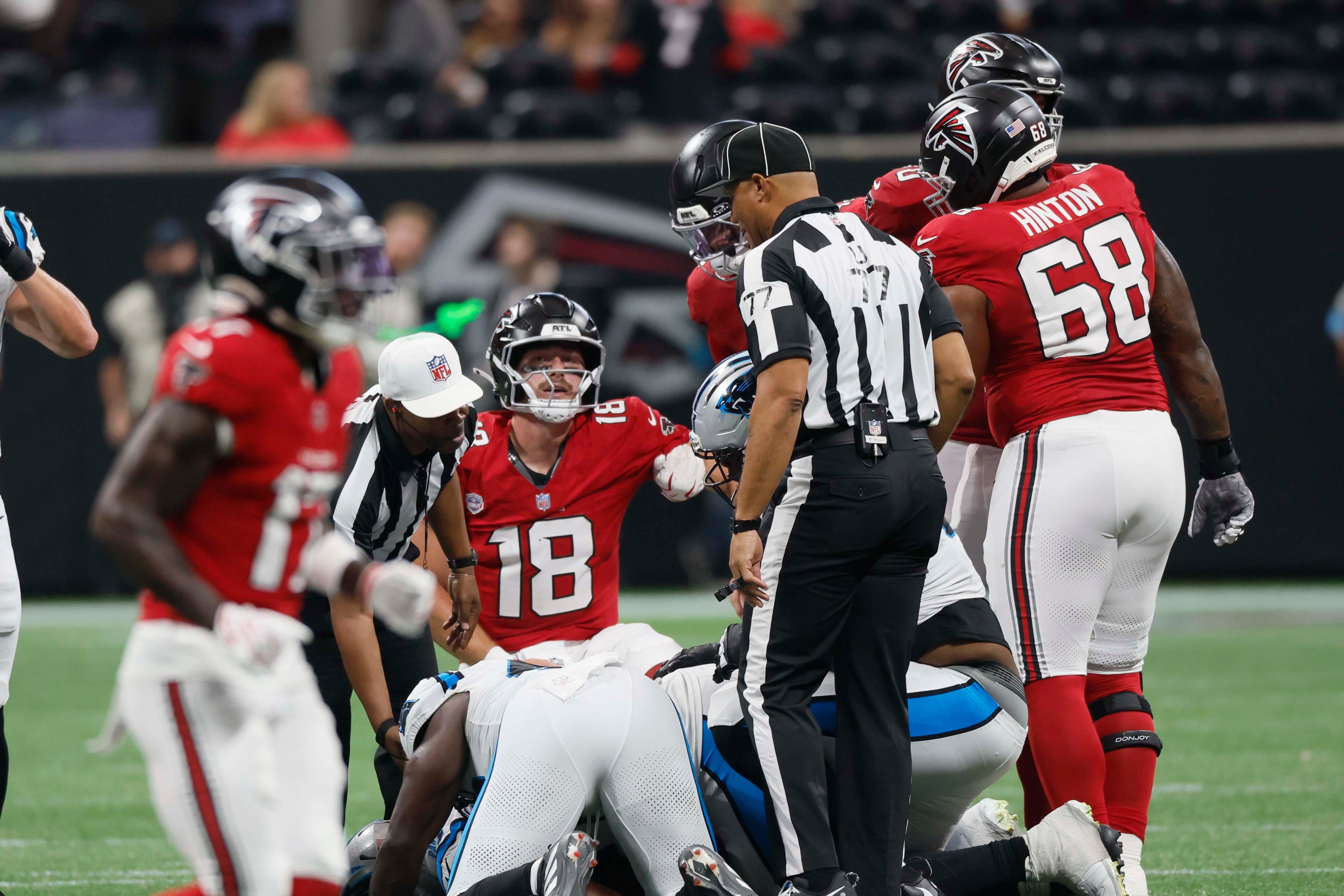 Atlanta Falcons quarterback Jack Strand (18) tries to recover after a fumble during the second half of an NFL football game against the Carolina Panthers at Mercedes-Benz Stadium in Atlanta on Sunday, Sept. 20, 2026. (Miguel Martinez/AJC)