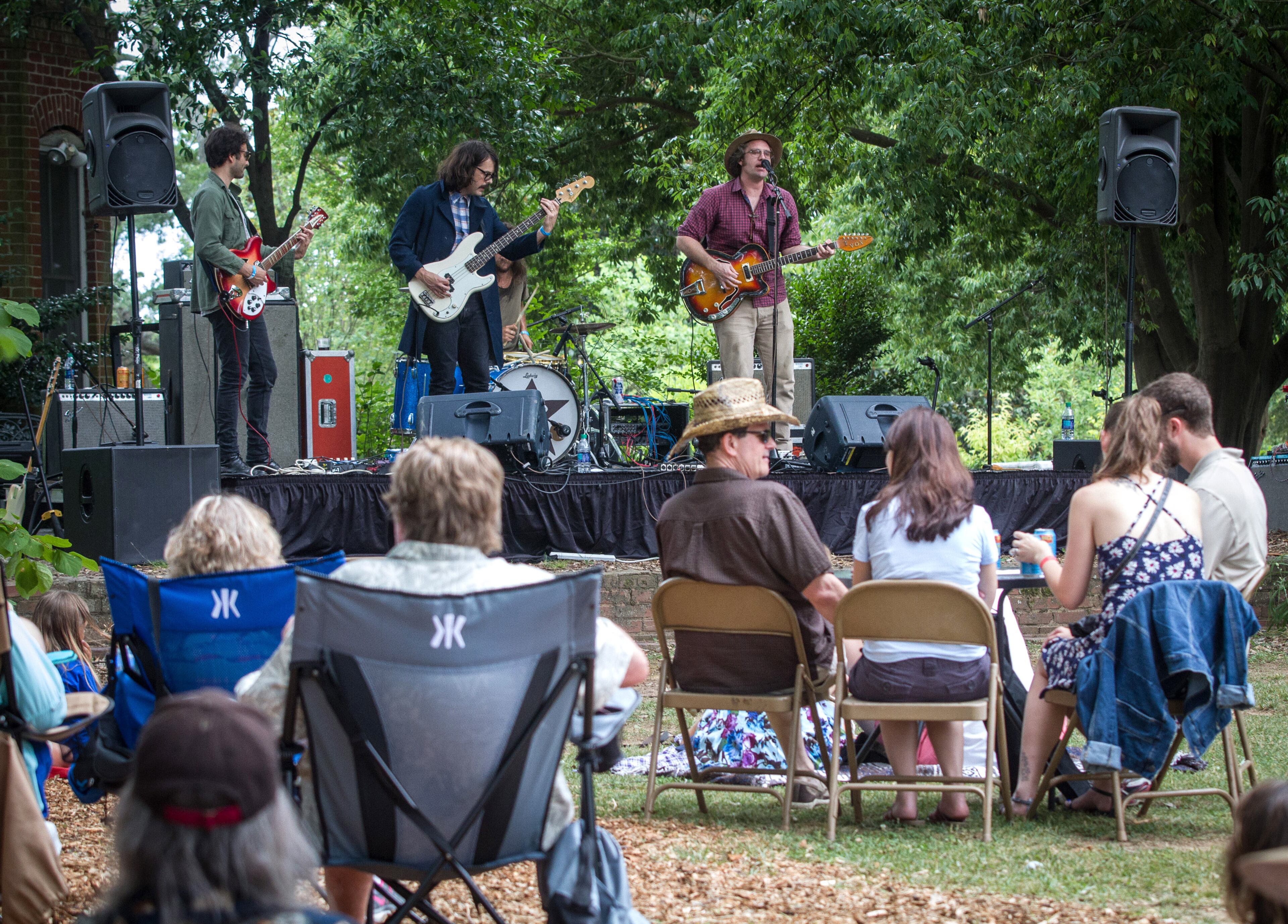 A crowd listens to Fauxgerty, a Creedence Clearwater Revival cover band, during the Tunes From The Tombs music festival in Oakland Cemetery Saturday, June 18, 2016, in Atlanta, Ga. STEVE SCHAEFER / SPECIAL TO THE AJC