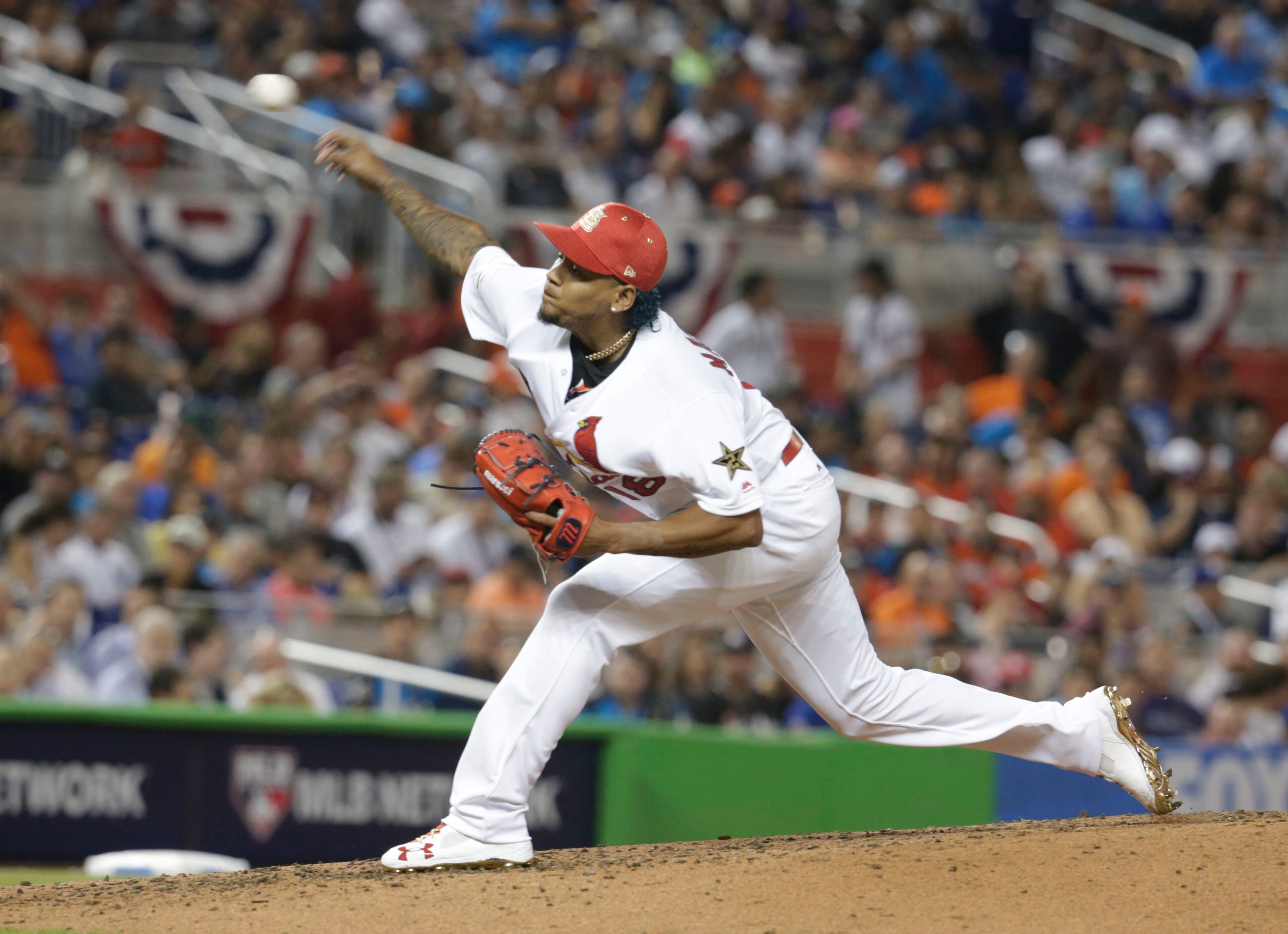 National League's St. Louis Cardinals pitcher Carlos Martĺnez (18), delivers a pitch, during the third inning at the MLB baseball All-Star Game, Tuesday, July 11, 2017, in Miami. (AP Photo/Lynne Sladky)