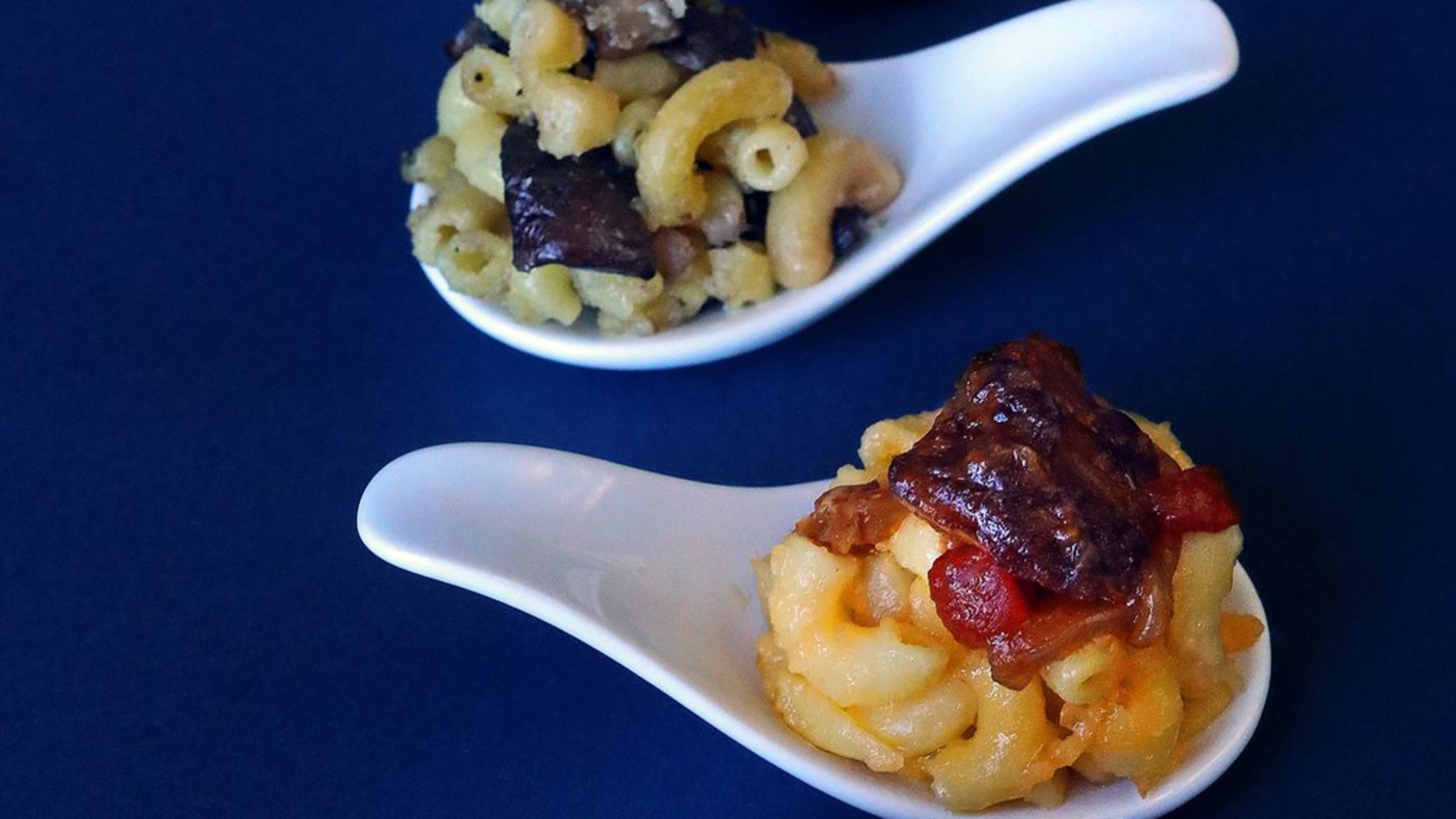 Four macaroni and cheese offerings with different toppings are photographed on Wednesday, Jan. 17, 2018. From the bottom up: Mac and cheese with Buffalo Chicken Topping, Mac and cheese with a Five-Spice Beef Topping, Wild Mushroom Macaroni and Cheese and Mac and cheese with a Barbecued Brisket Topping. (Christian Gooden/St. Louis Post-Dispatch/TNS)