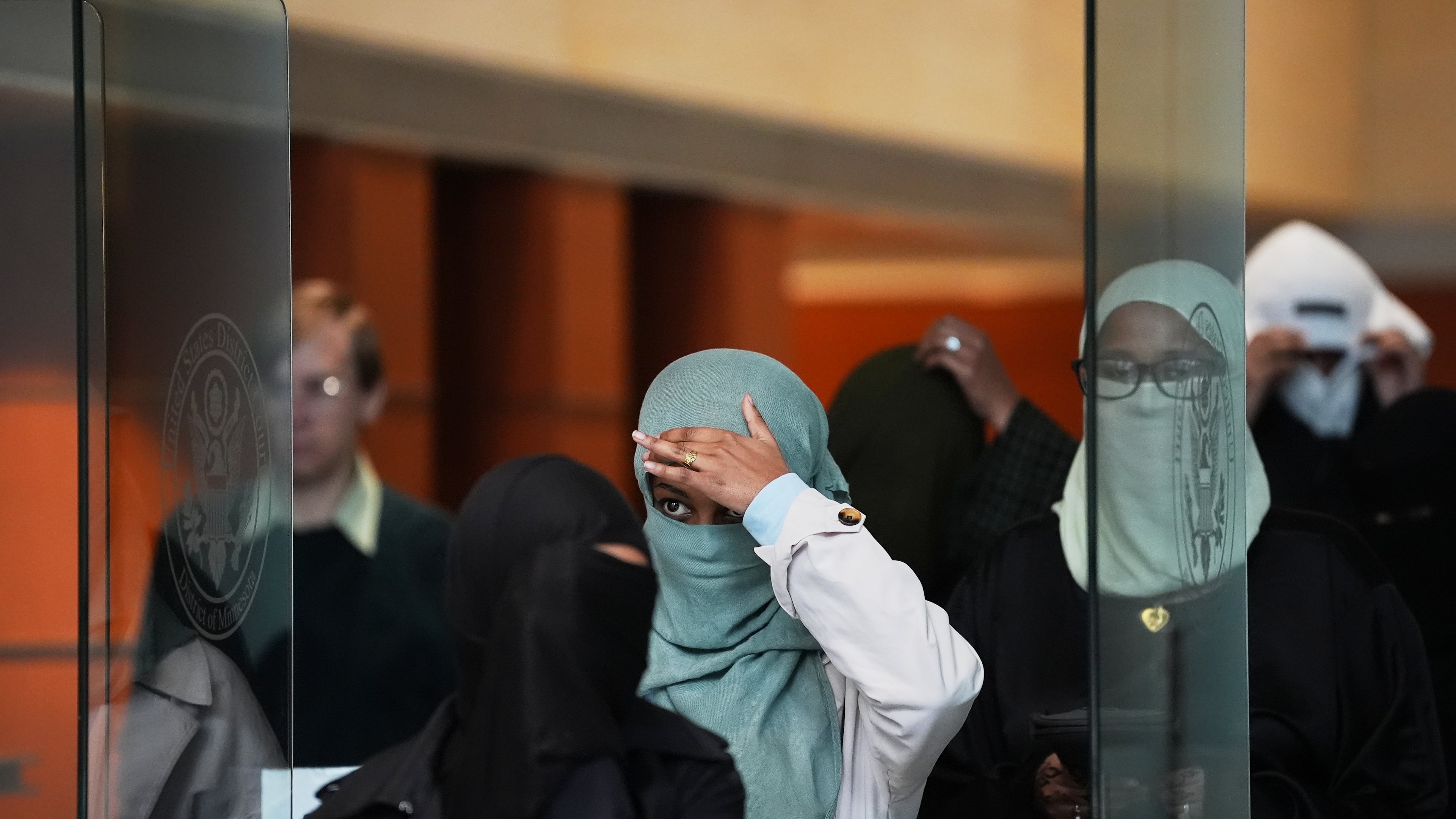 Supporters of Salim Said, who was found guilty in the Feeding Our Future fraud scheme, leave after Said's sentencing hearing, Wednesday, Oct. 28, 2026, in Minneapolis. (AP Photo/Ellen Schmidt)