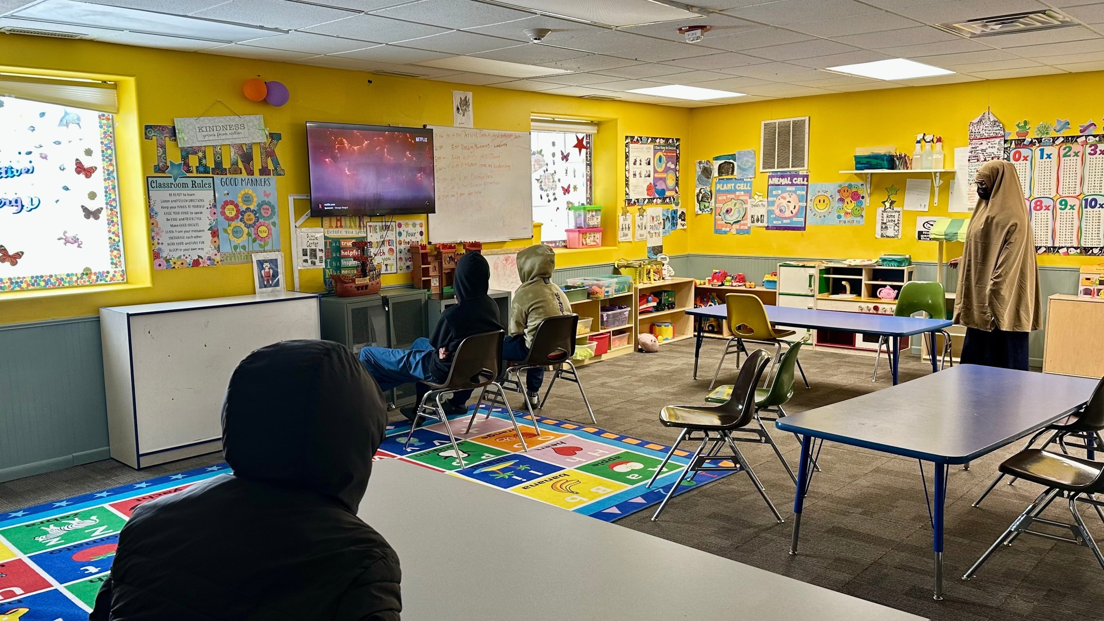 Children watch television at ABC Learning Center in Minneapolis, Minn., on Wednesday, Dec. 31, 2025. (AP Photo/Mark Vancleave)