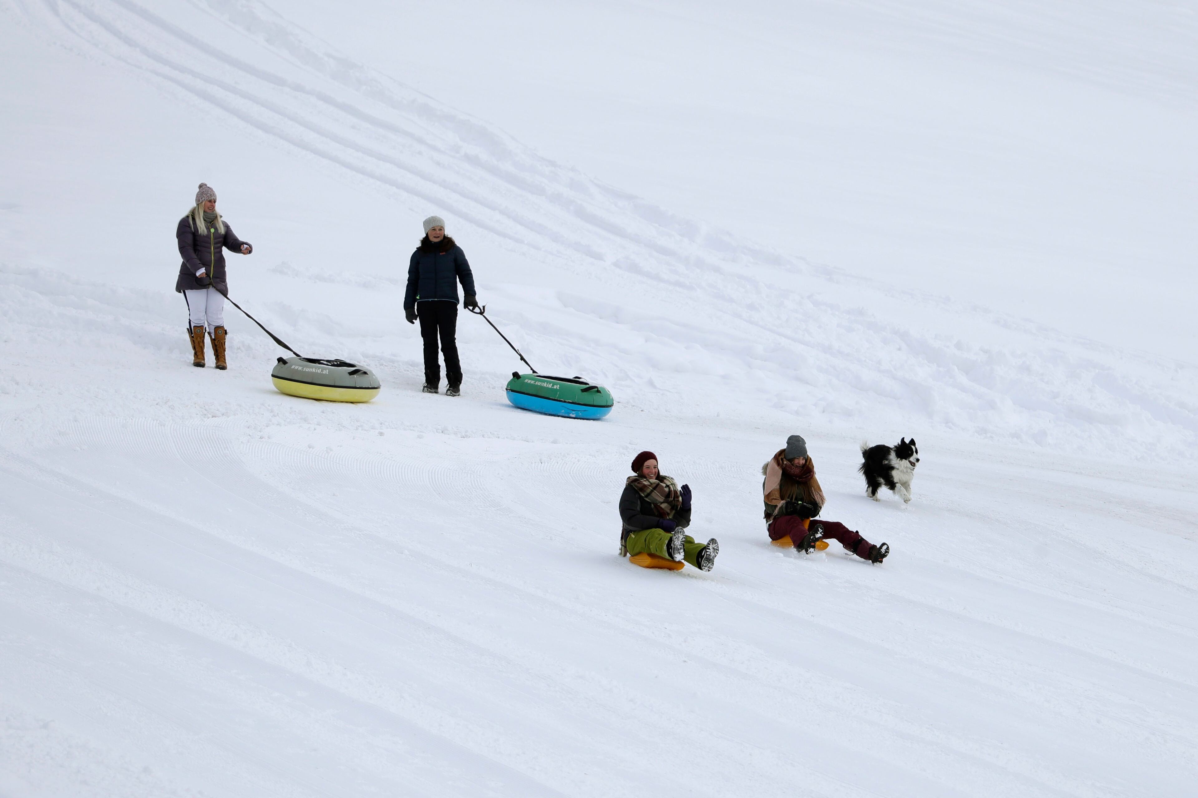People enjoy themselves in the snow in Werfenweng, near Salzburg, Austria, Saturday, Jan. 7, 2017. (AP Photo/Matthias Schrader)
