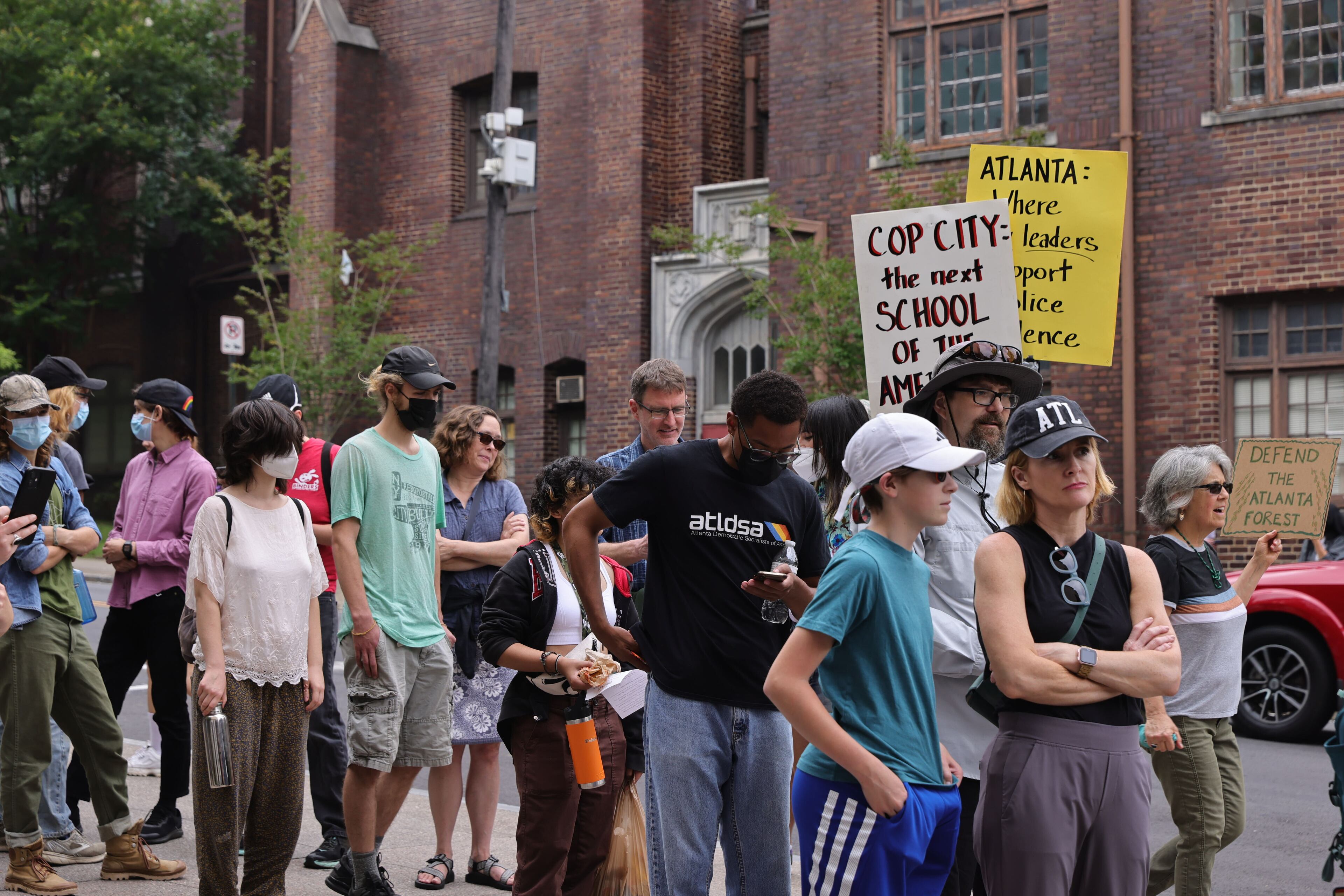 People gather outside Atlanta City Hall ahead of the final vote to approve legislation the funds the training center on Monday, June 5, 2023. (Natrice Miller / natrice.miller@ajc.com)