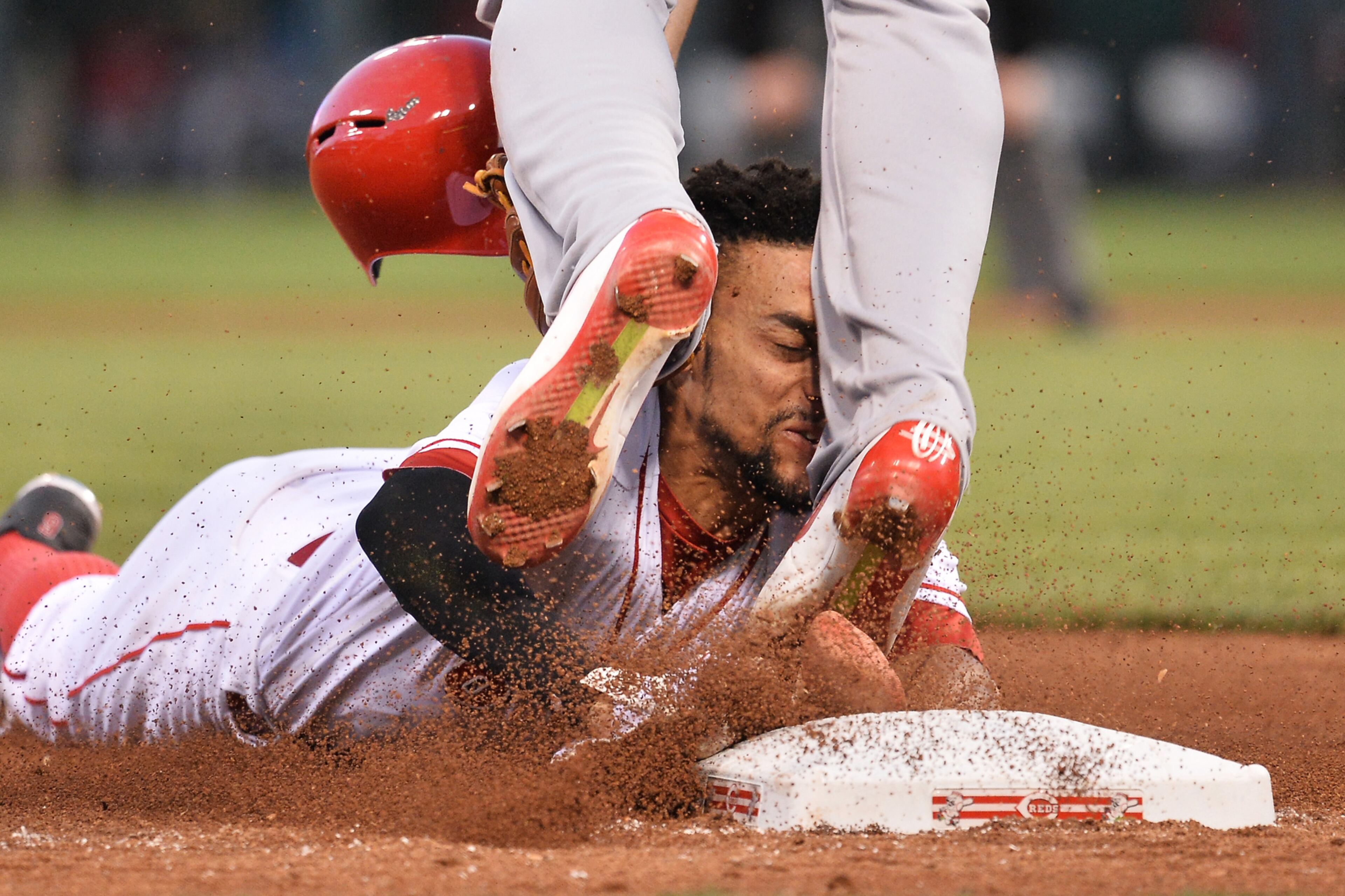LEGGING IT OUT--CINCINNATI, OH - JUNE 8: Billy Hamilton #6 of the Cincinnati Reds slides into the legs of Jhonny Peralta #27 of the St. Louis Cardinals while trying to steal third base in the fifth inning at Great American Ball Park on June 8, 2016 in Cincinnati, Ohio. Hamilton was called out as St. Louis defeated Cincinnati 12-7. (Photo by Jamie Sabau/Getty Images) ***BESTPIX***