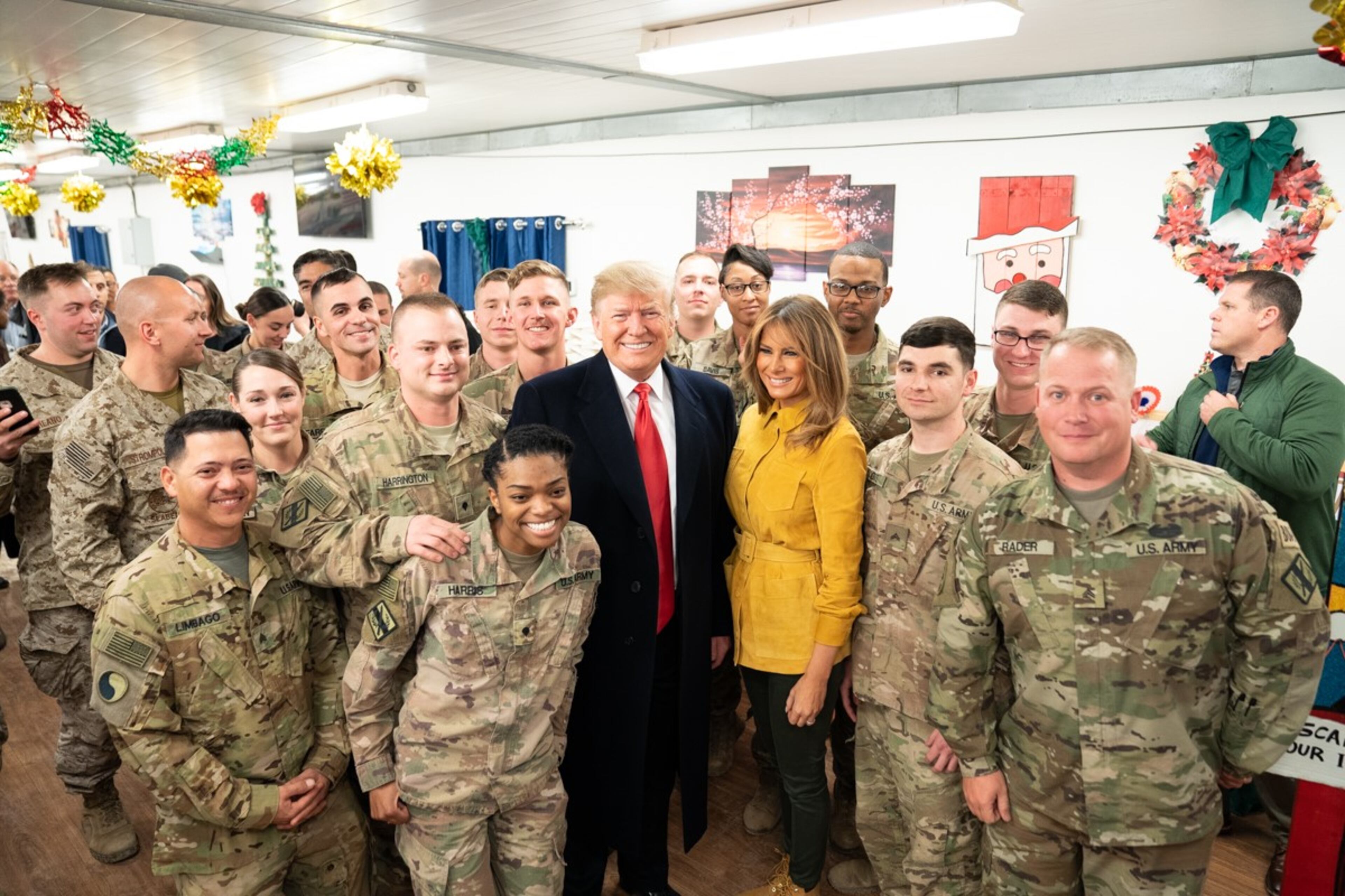 President Donald J. Trump and First Lady Melania Trump pose for a group photo with U.S. troops Wednesday, December 26, 2018, during their visit to the Al-Asad Airbase in Iraq.