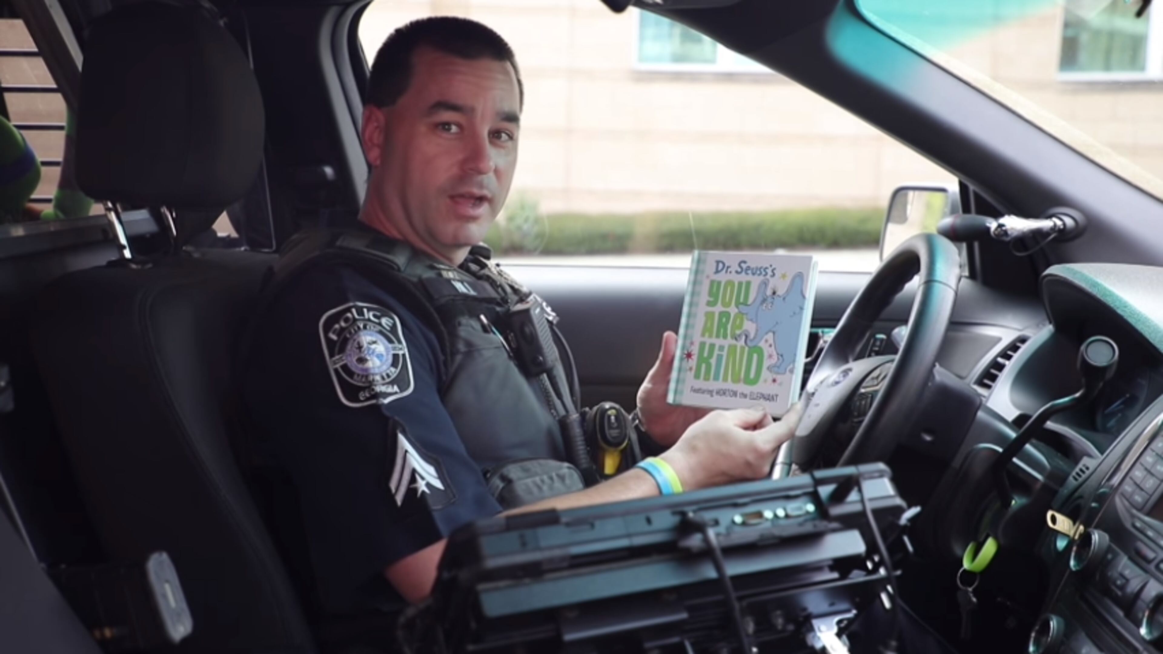 Marietta school resource officer Paul Hill was filmed reading Dr. Seuss' "You Are Kind" from his patrol vehicle.