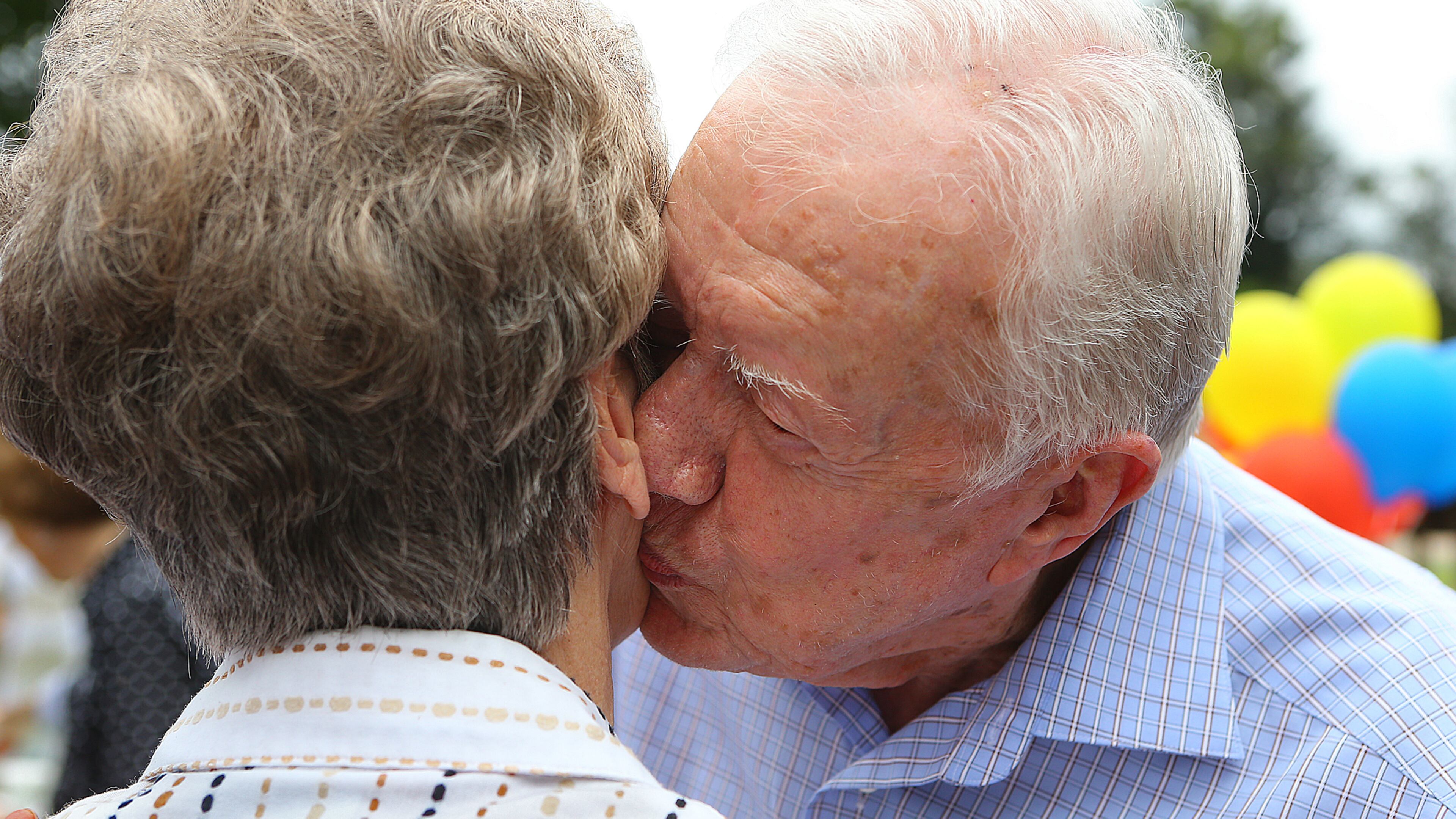 Former President Jimmy Carter gives Carol Anderson a kiss on the cheek while thanking the hometown folks one at a time in a receiving line during his 90th birthday party they threw for him at Maxine Reese Park on Sunday, Sept. 28, 2014, in Plains. The former president will be 97 on Friday, Oct. 1. CURTIS COMPTON / CCOMPTON@AJC.COM