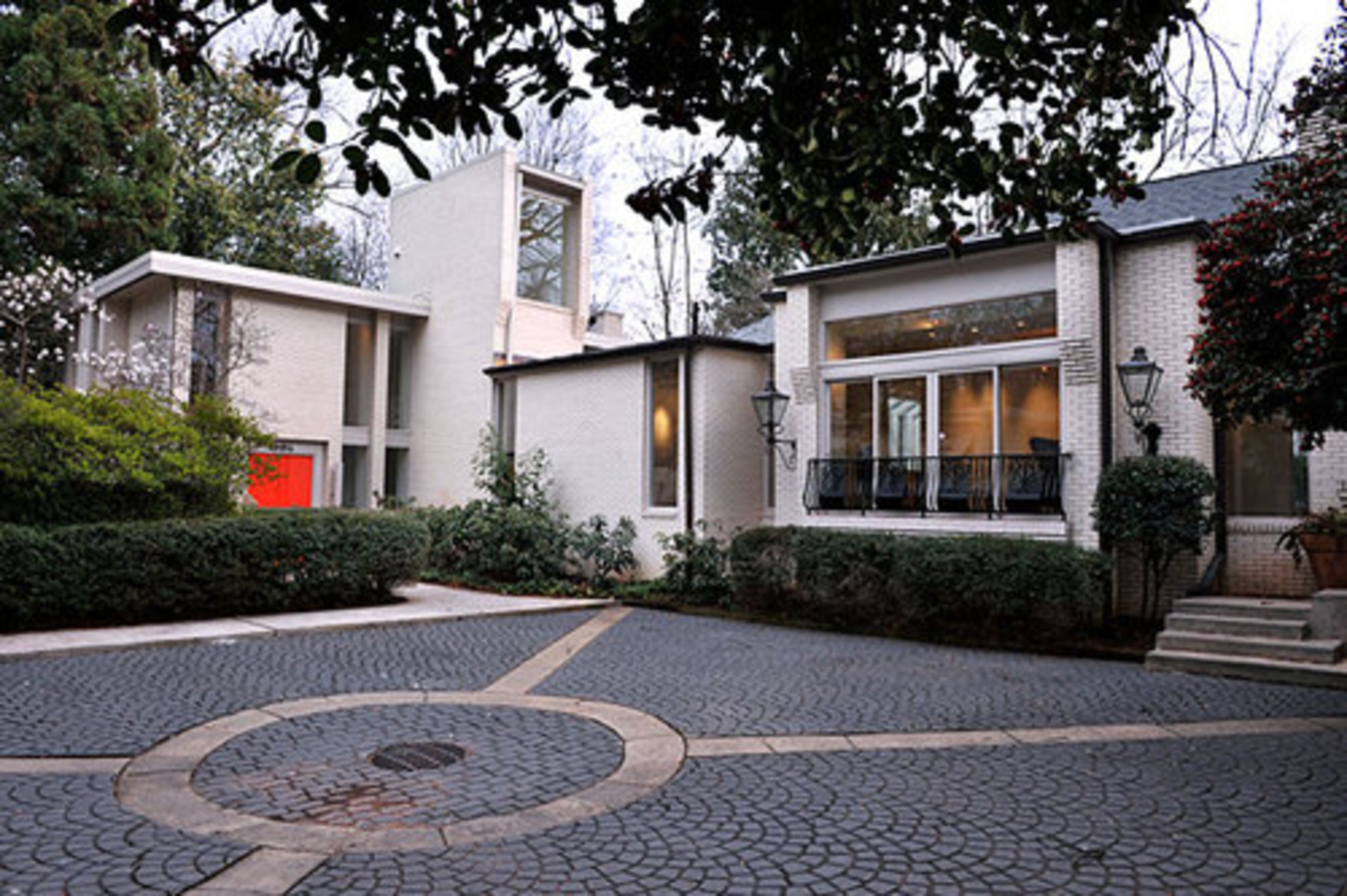 As Jova's fortunes improved, his home grew into an L-shaped complex grouped around a gated courtyard. The most recent renovation, completed by Jova and his partner of more than 30 years, David Rinehart, was designed to perfect the home's utility and flexability. Jova calls it "a display house."