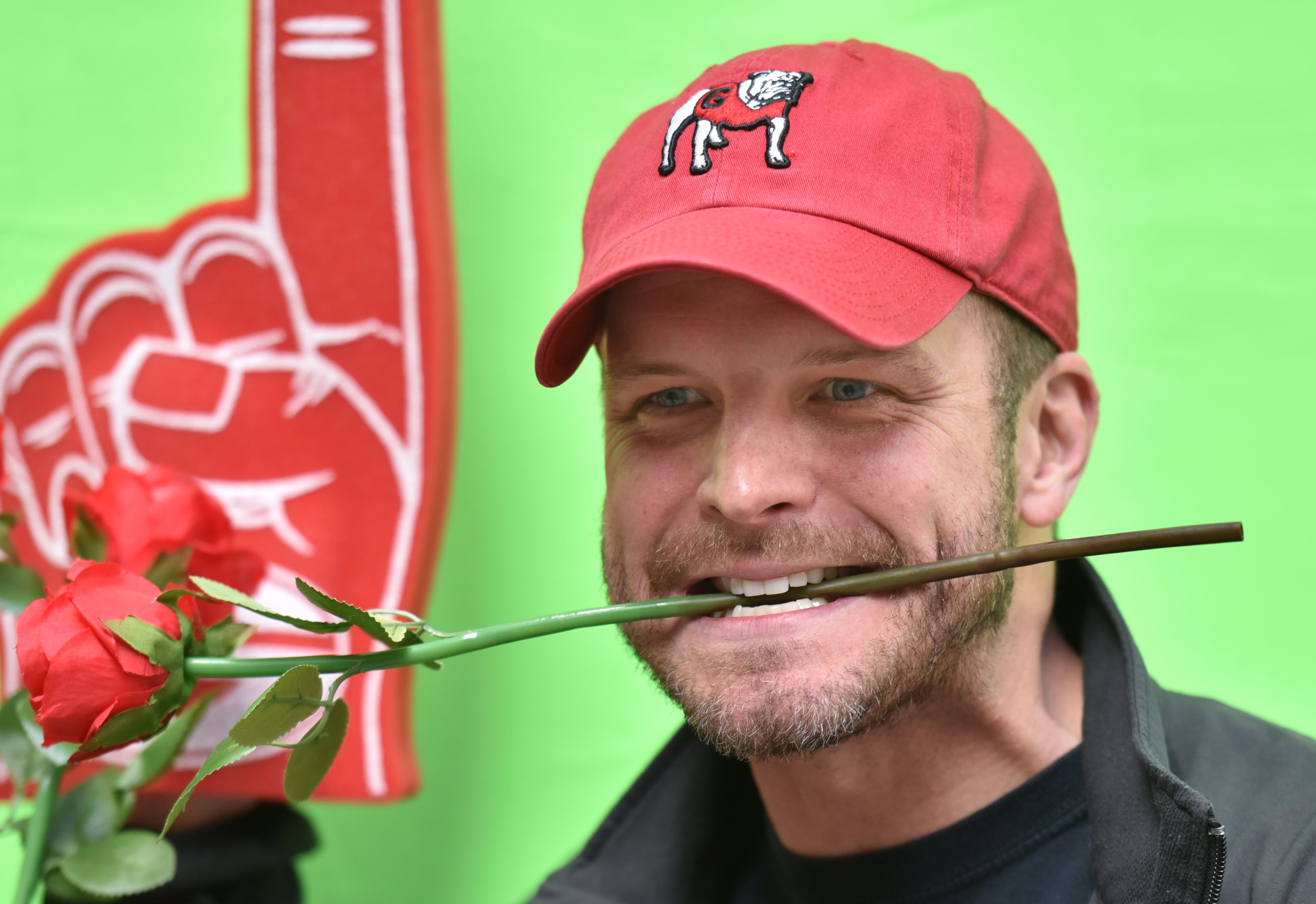 December 31, 2017 Los Angeles, California - Connor Flagel (center), of Marietta, plays a game of corn hole during the Rose Bowl Bash in downtown Los Angeles on Sunday, December 31, 2017. Hyosub Shin / hshin@ajc.com