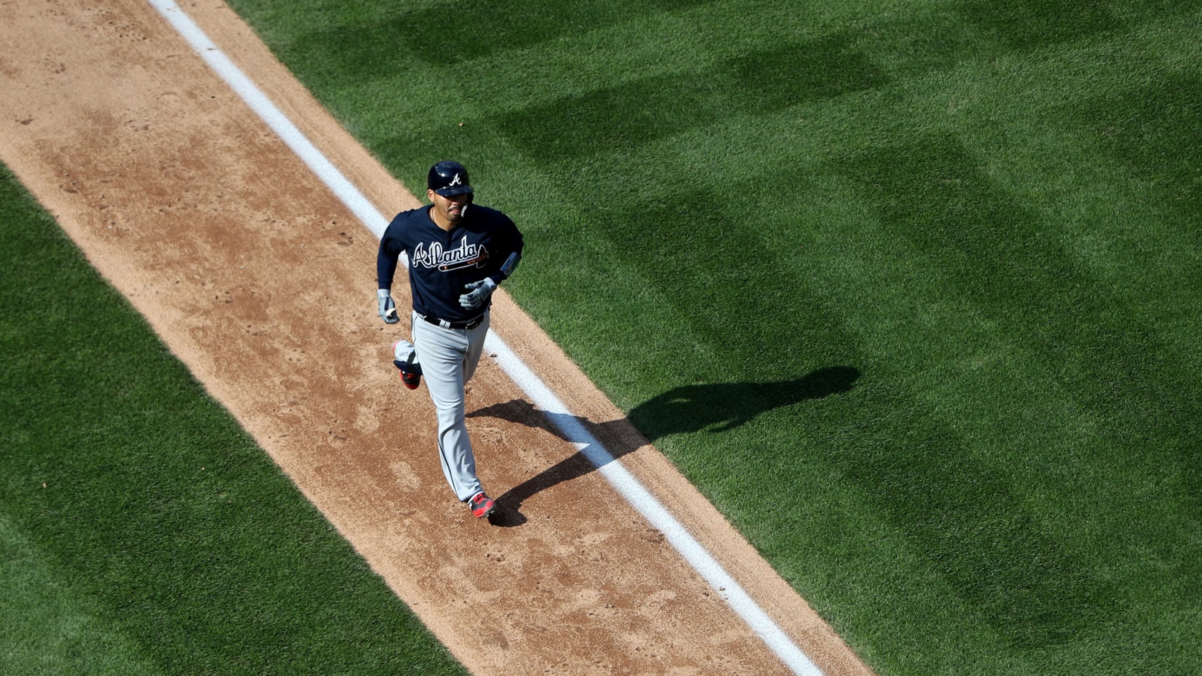 Kurt Suzuki rounds the bases after his 11th-inning homer Wednesday, his second of the game. (Photo by Rob Carr/Getty Images)
