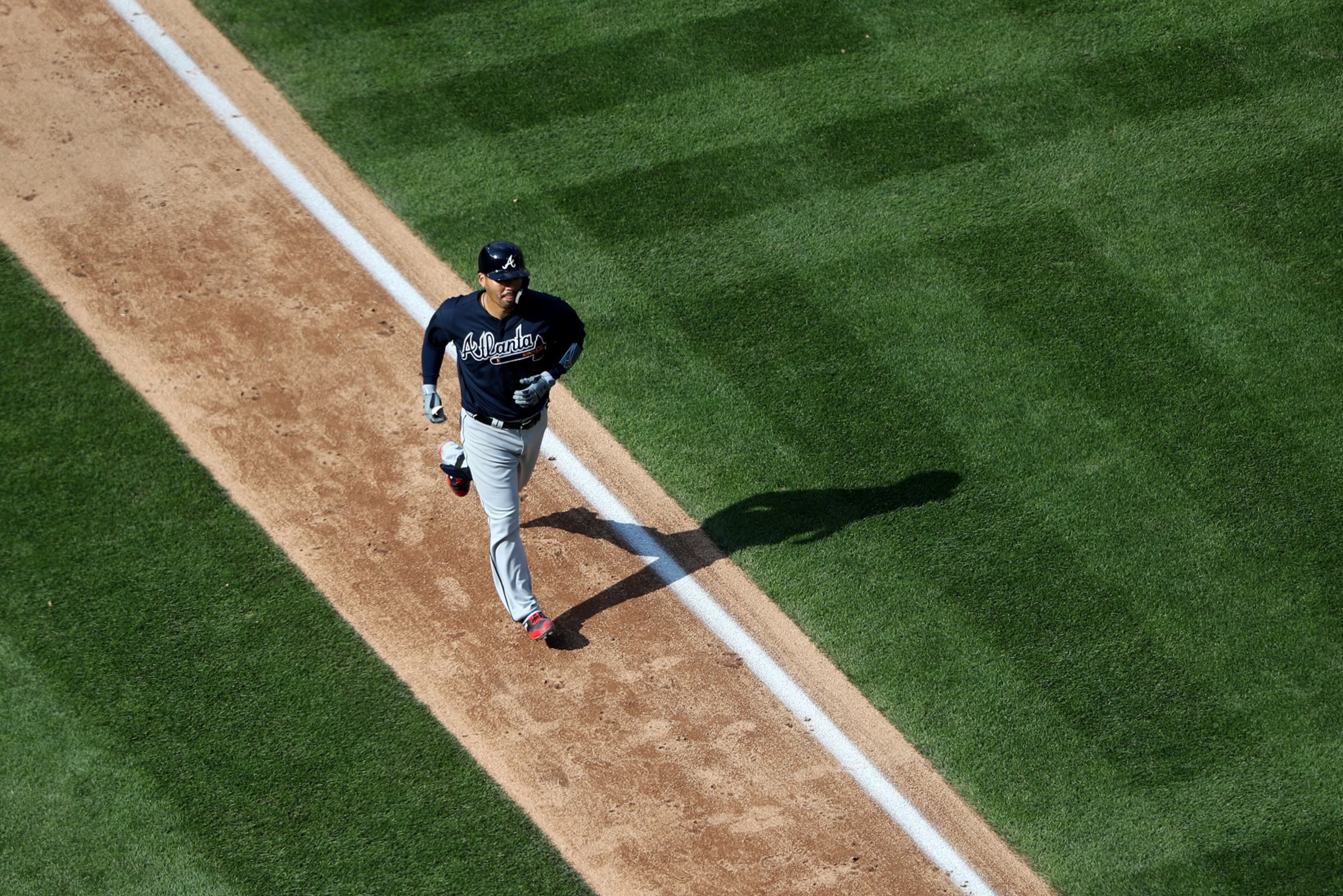 WASHINGTON, DC - APRIL 11: Kurt Suzuki #24 of the Atlanta Braves rounds the bases after hitting a solo home run in the eleventh inning of the Braves 5-3 win over the Washington Nationals at Nationals Park on April 11, 2018 in Washington, DC. (Photo by Rob Carr/Getty Images)