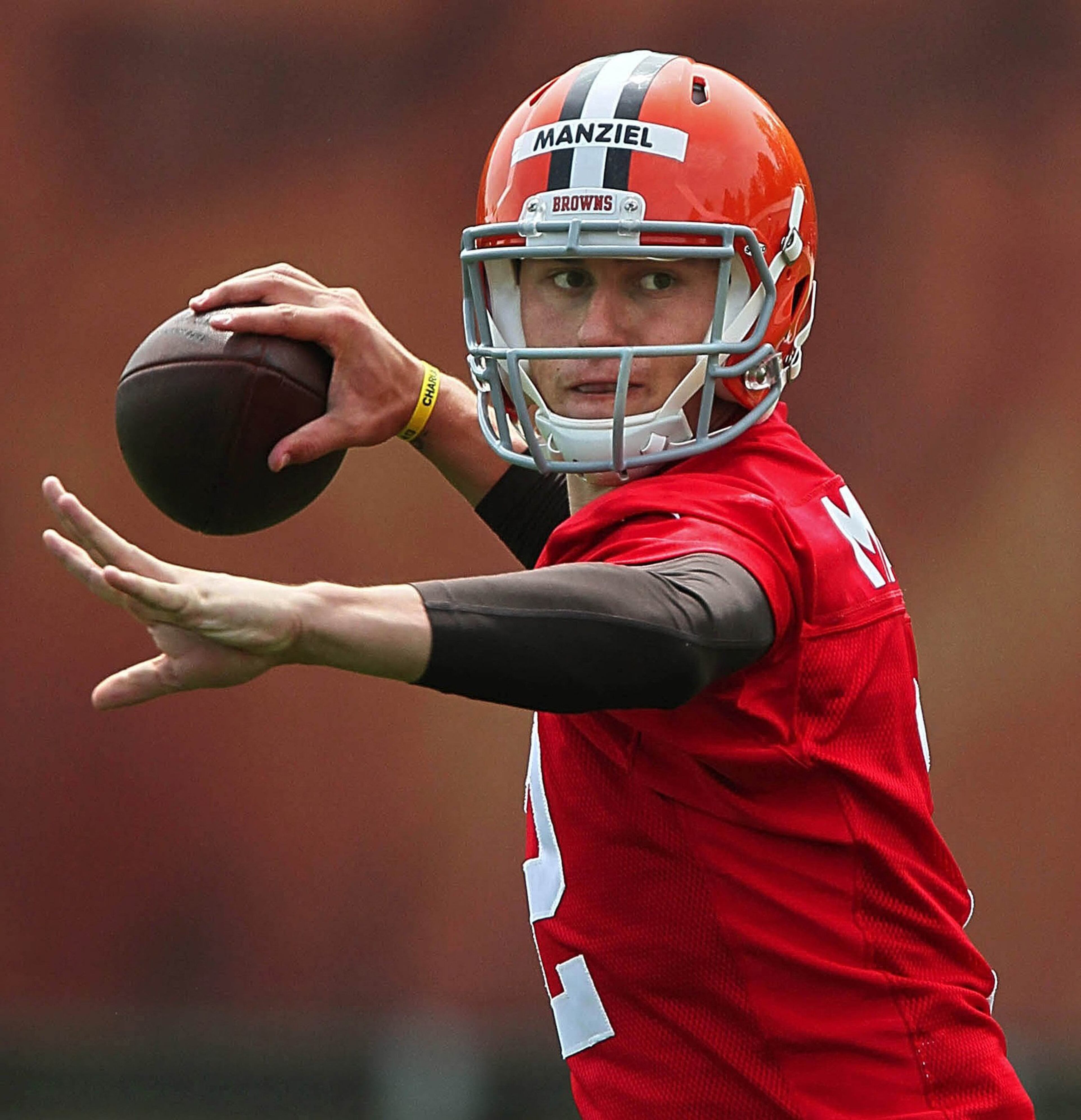 Cleveland Browns quarterback Johnny Manziel throws a pass during the organized team activities at the team's training facility in Berea, Ohio.