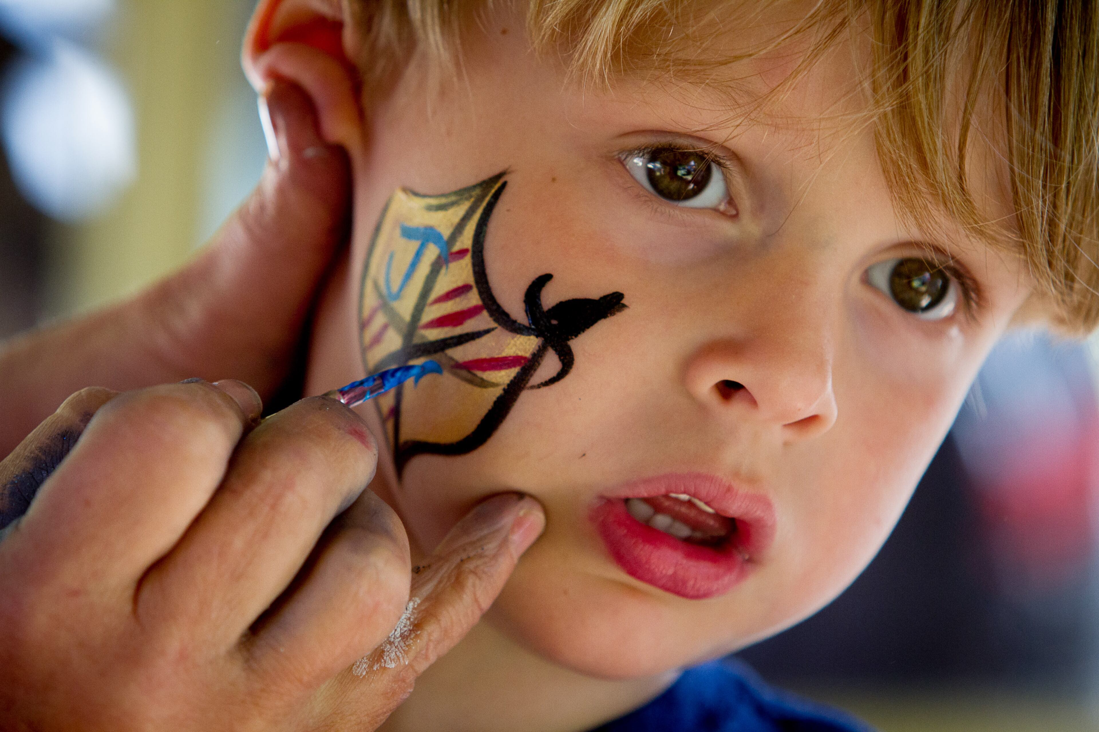 Jonathan Perrin gets his face painted during the Georgia Renaissance Festival in Fairburn, Ga. Saturday April 16, 2016. STEVE SCHAEFER / SPECIAL TO THE AJC
