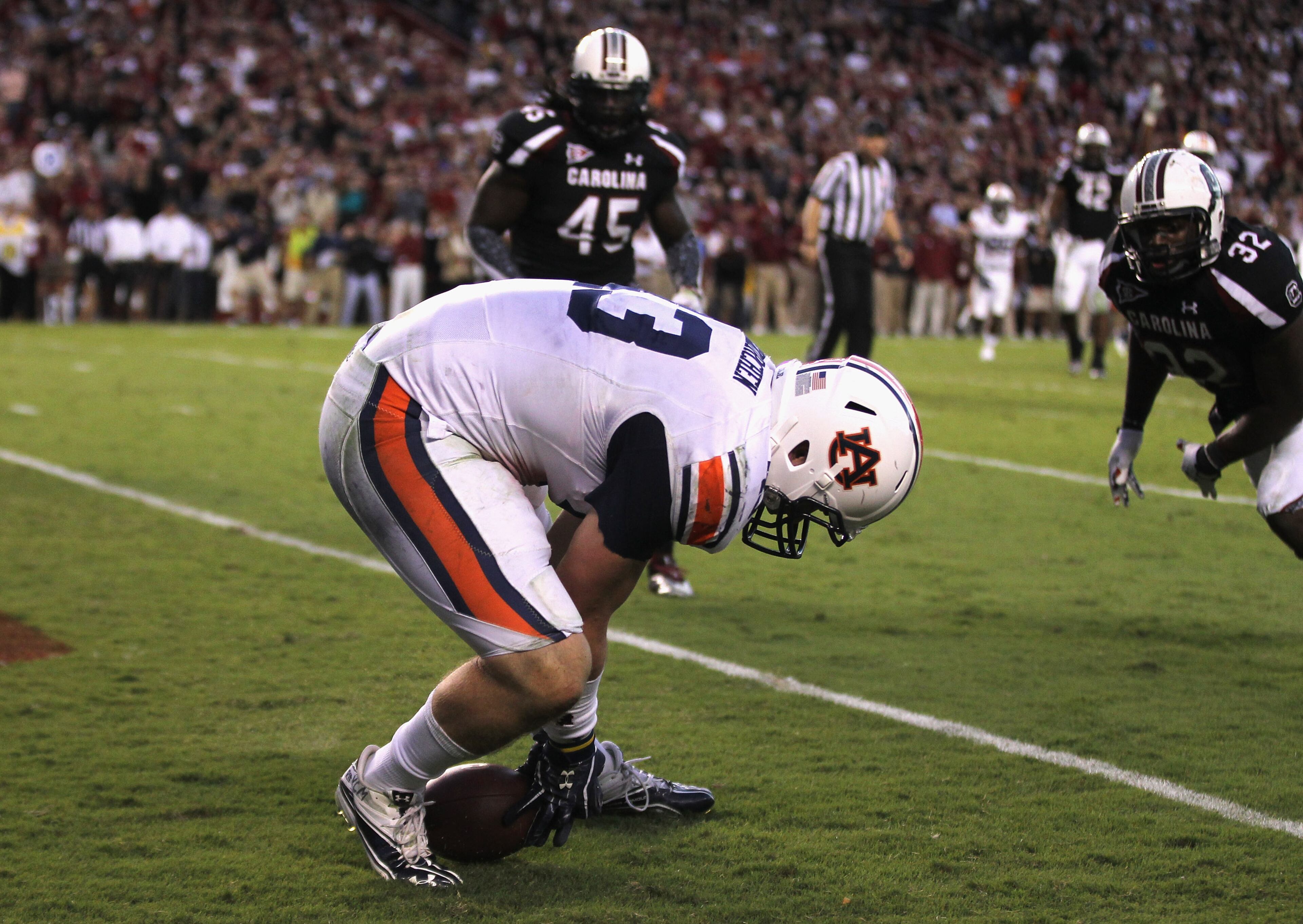 Philip Lutzenkirchen #43 of the Auburn Tigers fumbles the ball and then picks it up for the game winning touchdown as Reginald Bowens #32 of the South Carolina Gamecocks tries to make the stop during their game at Williams-Brice Stadium on October 1, 2011 in Columbia, South Carolina. (Photo by Streeter Lecka/Getty Images) Lutzenkirchen died in multiple-fatality crash in the early morning hours of Sunday, June 29, 2014.