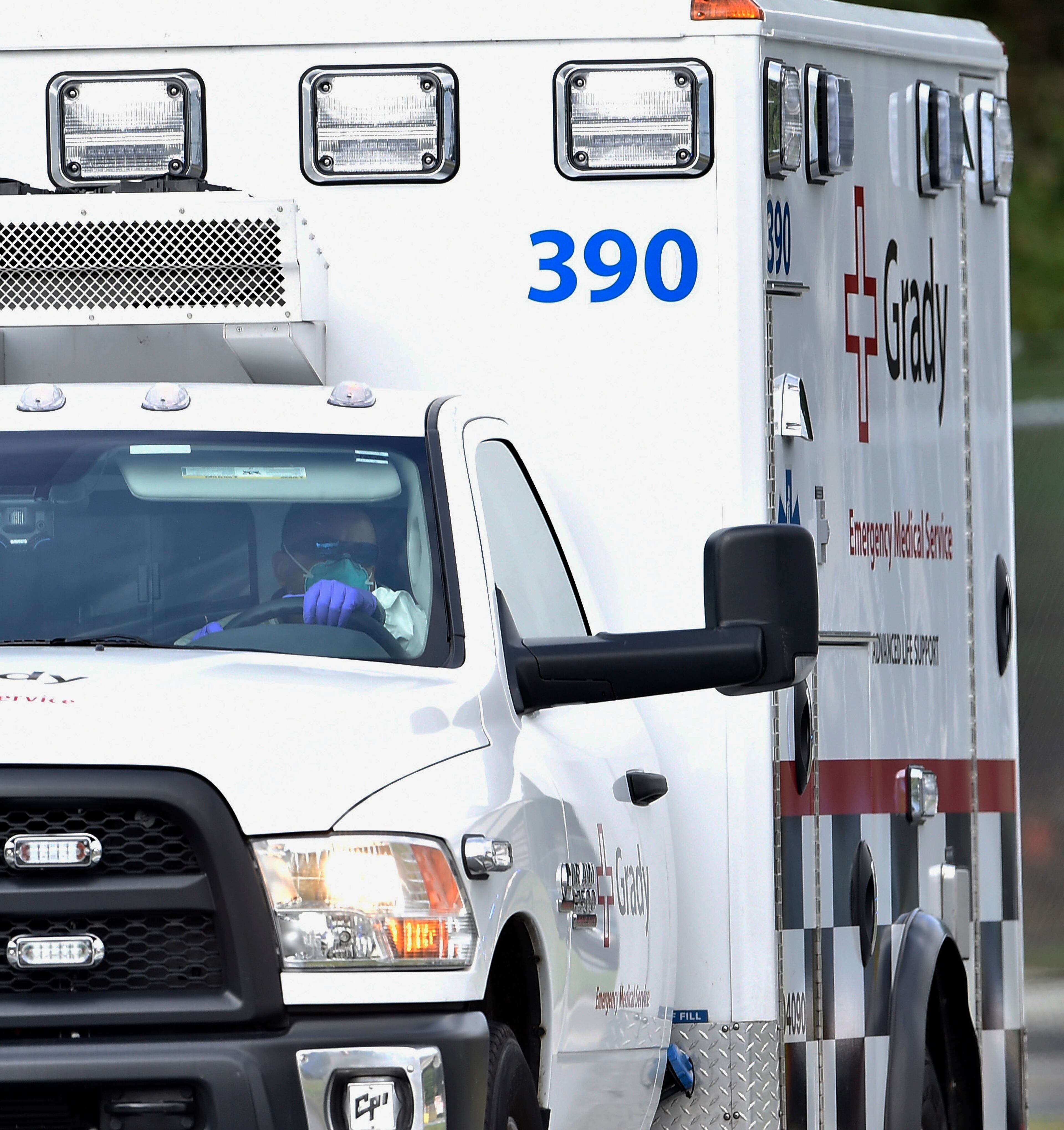 An ambulance transporting an American infected with the deadly Ebola virus from West Africa, leaves Dobbins Air Reserve Base Tuesday, Sept. 9, 2014 in Marietta, Ga., for Emory University Hospital in Atlanta. A joint emergency isolation unit administered by Emory University Hospital and the Centers for Disease Control and Prevention successfully treated two Americans last month in Atlanta. (AP Photo/David Tulis)