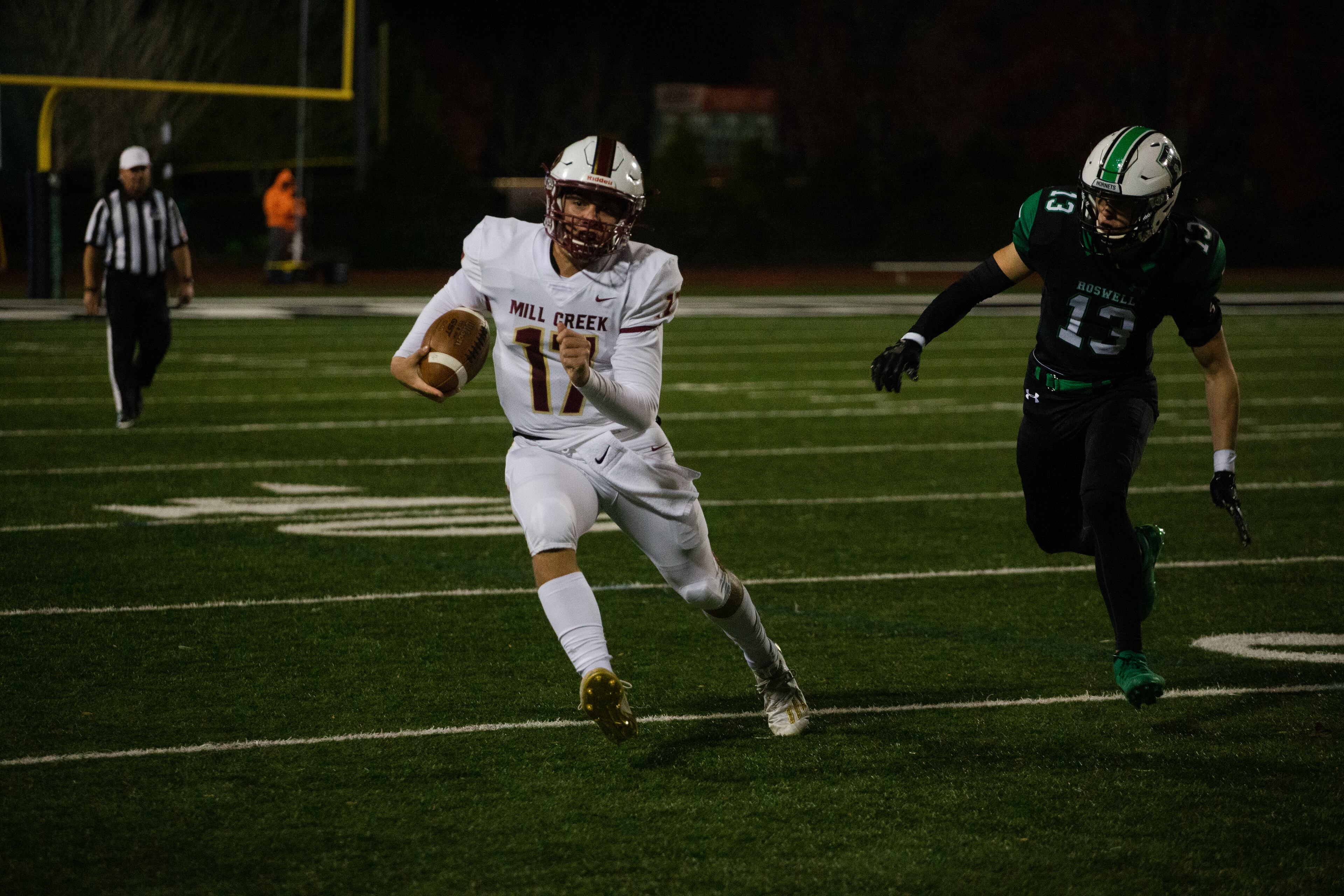 Hayden Clark, sophomore quarterback for Mill Creek, runs the ball
during the Mill Creek vs. Roswell high school football game on Friday, November 27, 2020, at Roswell High School in Roswell, Georgia. Mill Creek led Roswell 27-21 at the end of the third quarter. CHRISTINA MATACOTTA FOR THE ATLANTA JOURNAL-CONSTITUTION
