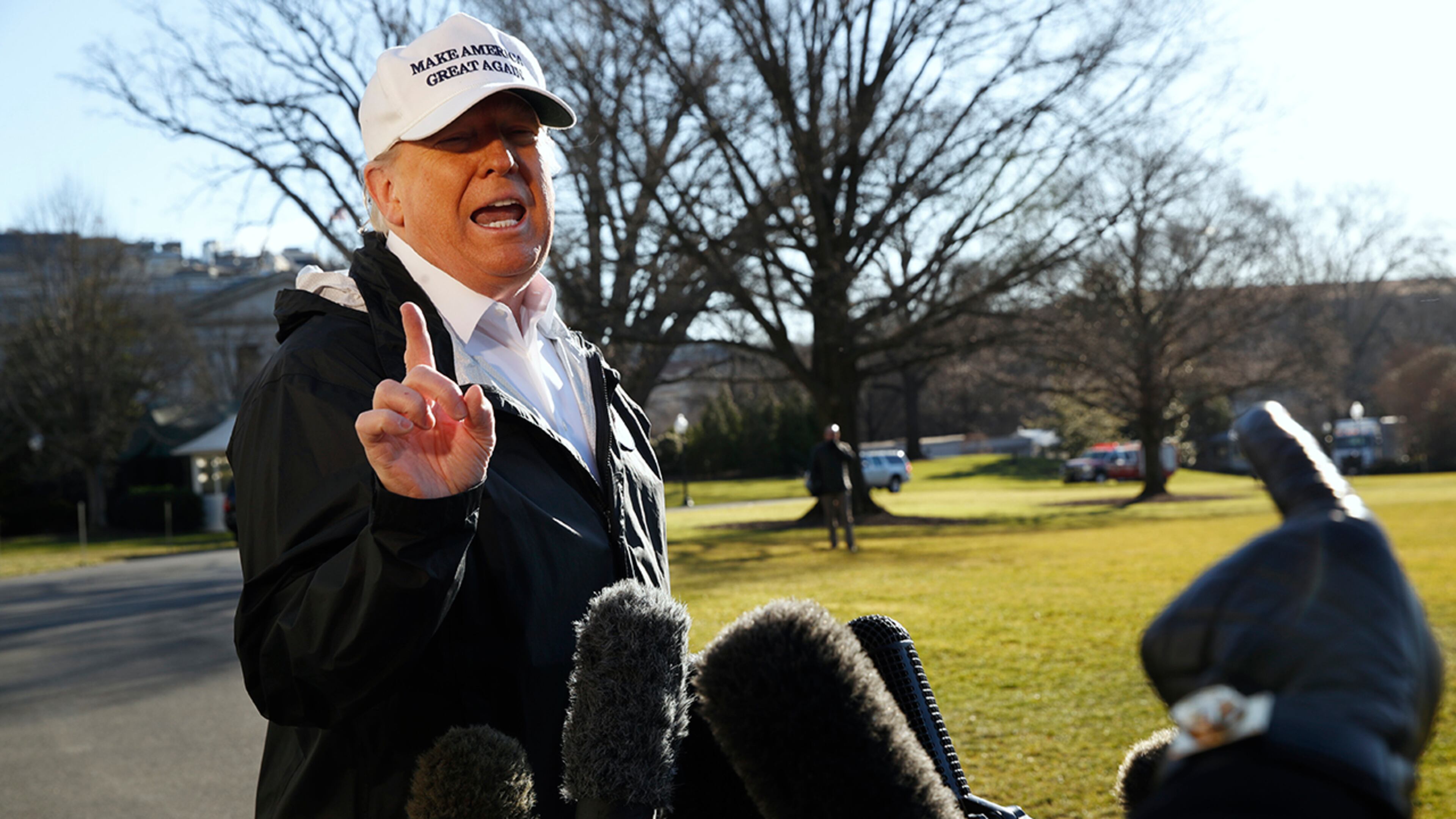 President Donald Trump gestures as a reporter asks a question, as he speaks to the media on the South Lawn of the White House, Thursday Jan. 10, 2019, in Washington, en route for a trip to the border in Texas as the government shutdown continues.