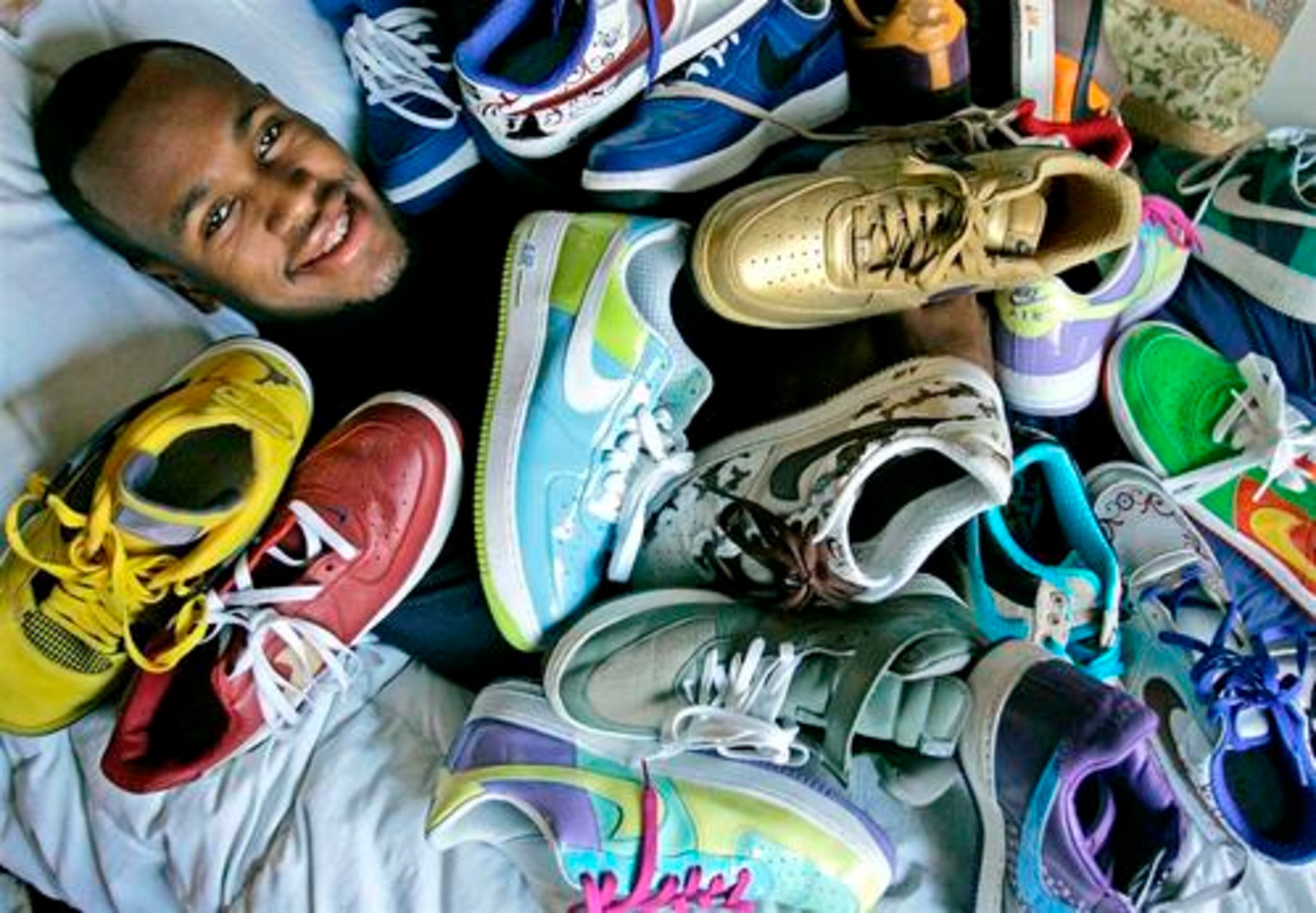 University of California at Berkeley basketball player Patrick Christopher is seen with some of the tennis shoes in his collection Wednesday, Jan. 16, 2008, in Berkeley, Calif.
