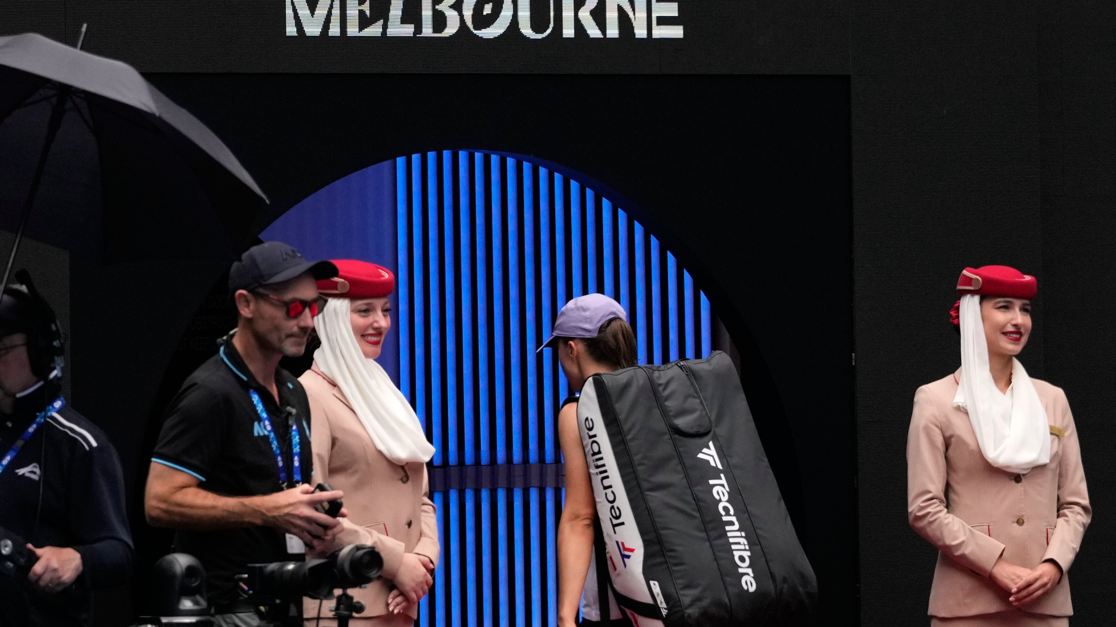 Iga Swiatek of Poland walks from the court following her quarterfinal loss to Elena Rybakina of Kazakhstan at the Australian Open tennis championship in Melbourne, Australia, Wednesday, Jan. 28, 2026. (AP Photo/Aaron Favila)