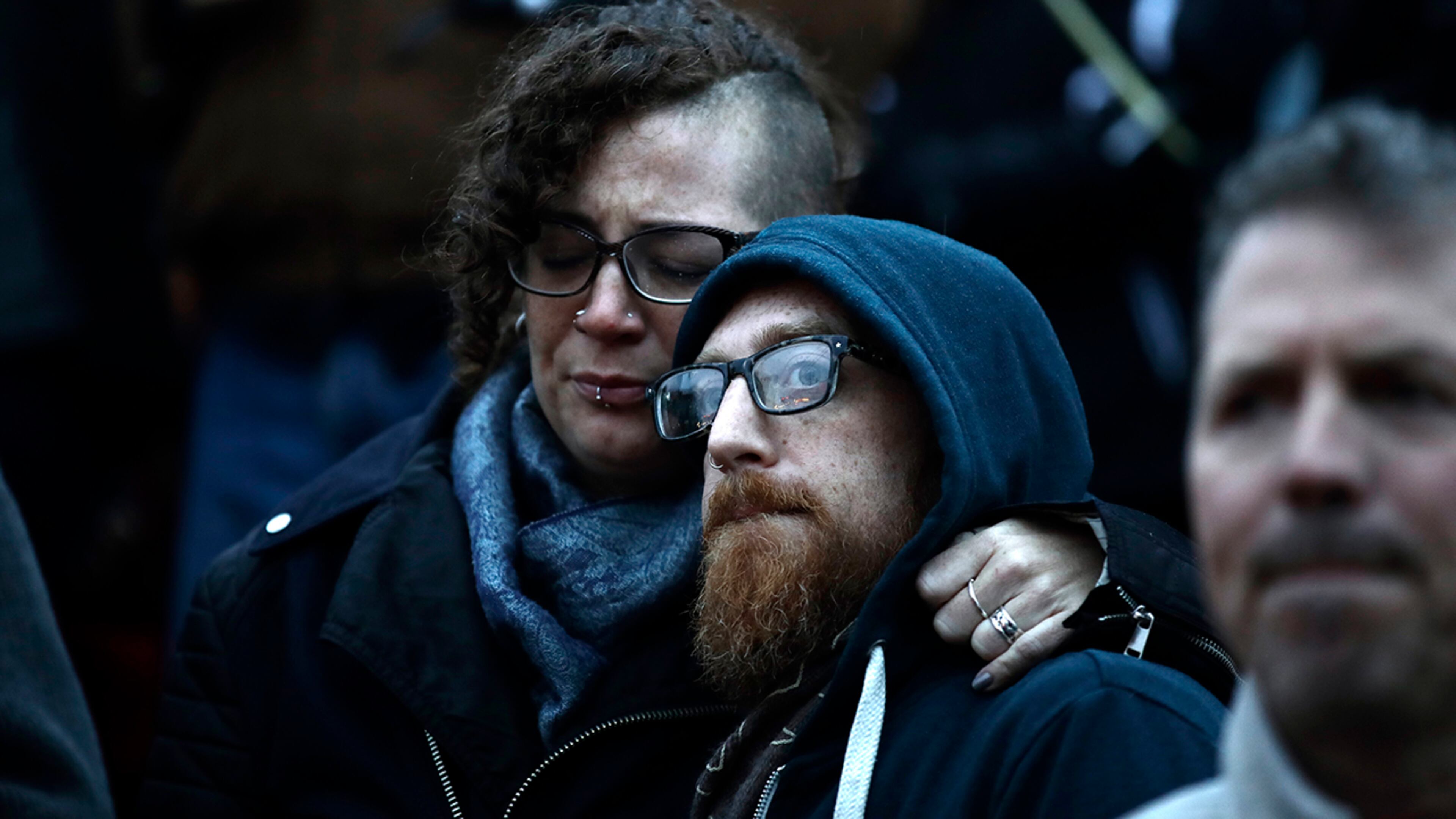 People gather for a vigil in the aftermath of a deadly shooting at the Tree of Life Congregation in Pittsburgh, Saturday, Oct. 27, 2018. (AP Photo/Matt Rourke)