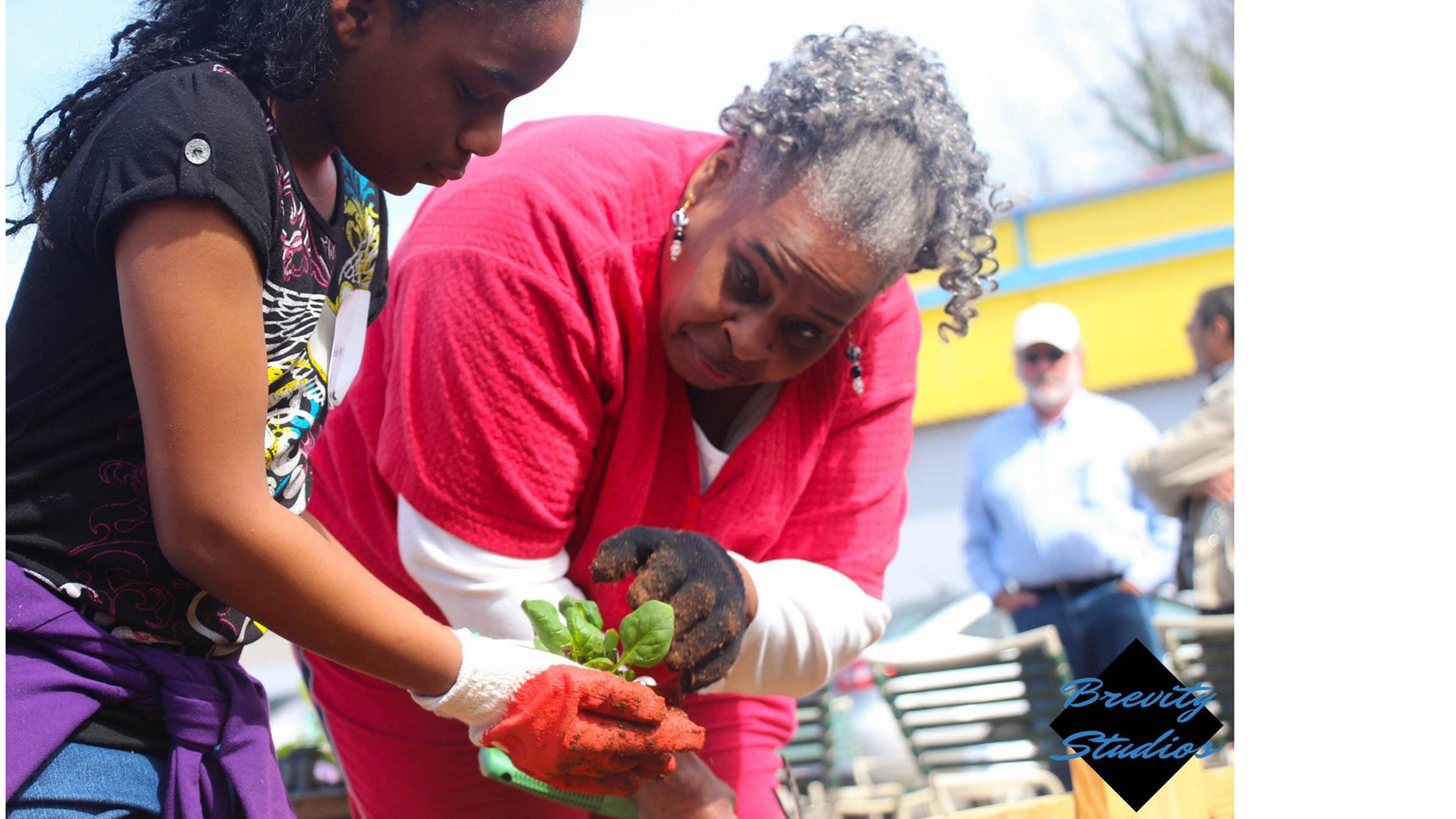 Volunteers work in the Super Giant Community Garden in Bankhead.