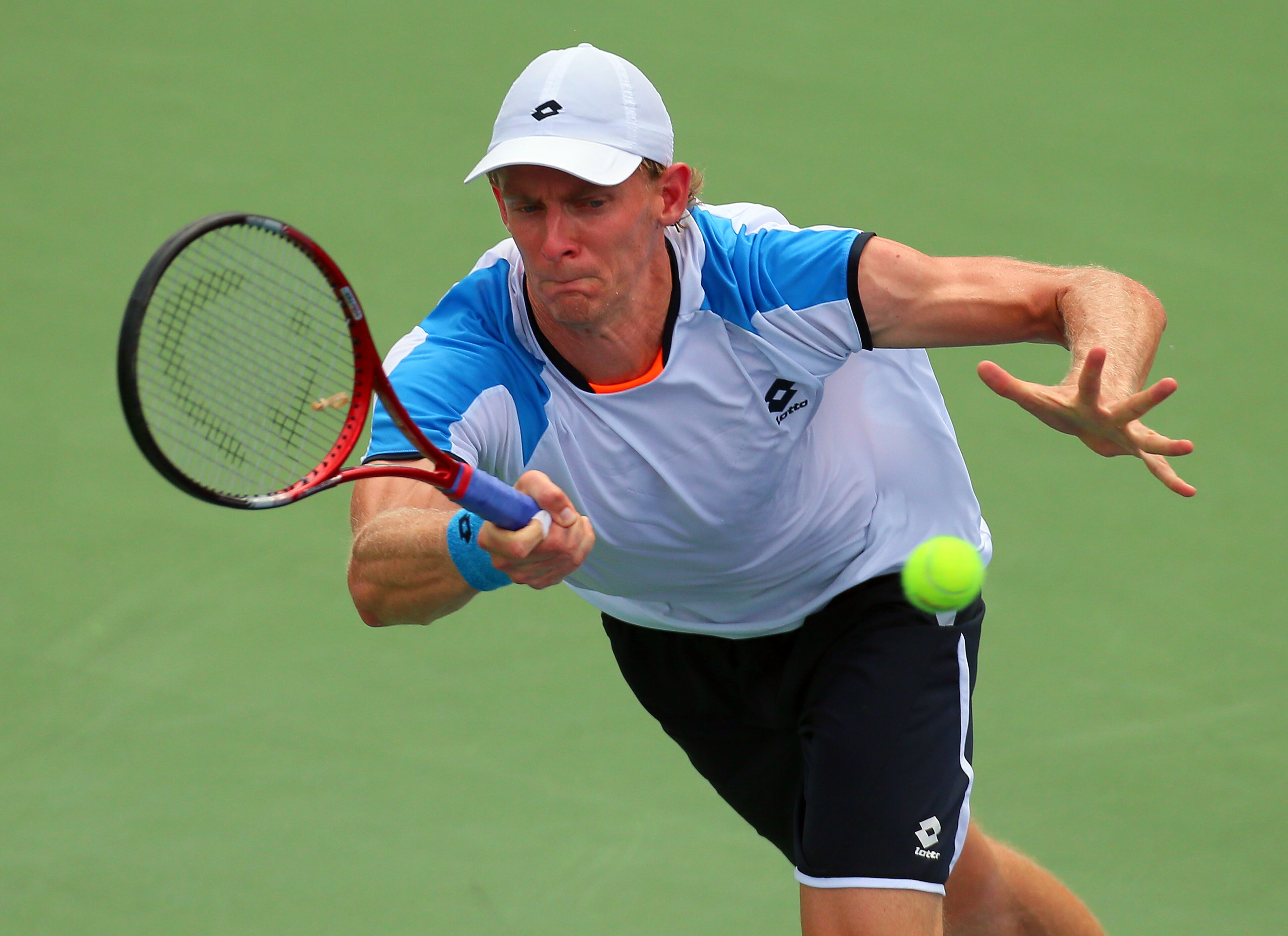 Kevin Anderson, South Africa, returns a shot to John Isner in the championship match.