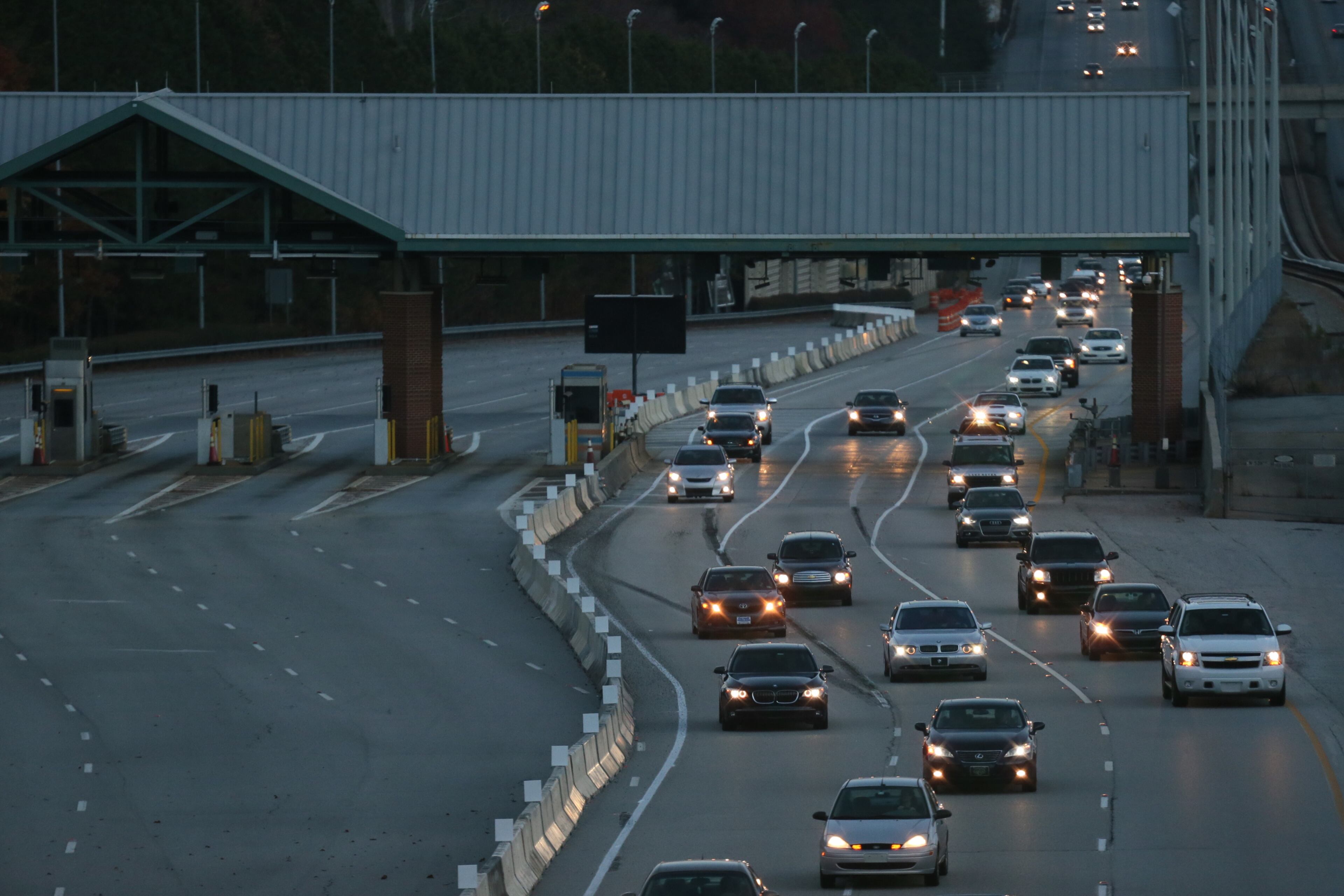 The scene at morning rush hour at the Ga 400 tolls. The tolls were closed on Friday after 20 years. Demolition of the toll will begin in January. Drivers can now use three lanes in each direction for free. However, the speed limit will be reduced to 45 mph through the construction zone while the work is in progress, and traffic will be rerouted through the Cruise Card lanes. BOB ANDRES/BANDRES@AJC.COM