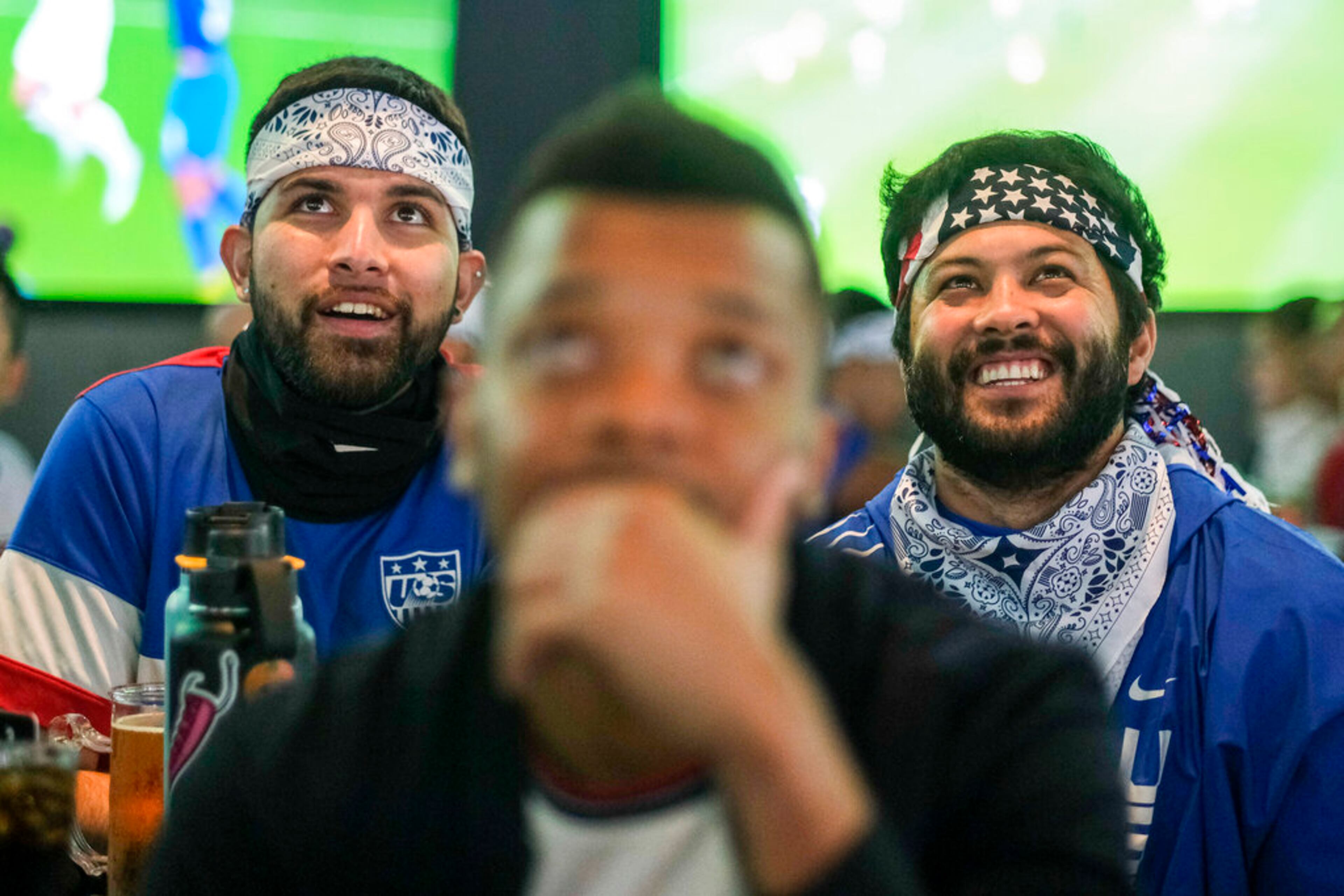 Soccer fans look on during a watch party for the World Cup group B soccer match between Iran and the United States in Los Angeles, Tuesday, Nov. 29, 2022. (AP Photo/Ringo H.W. Chiu)