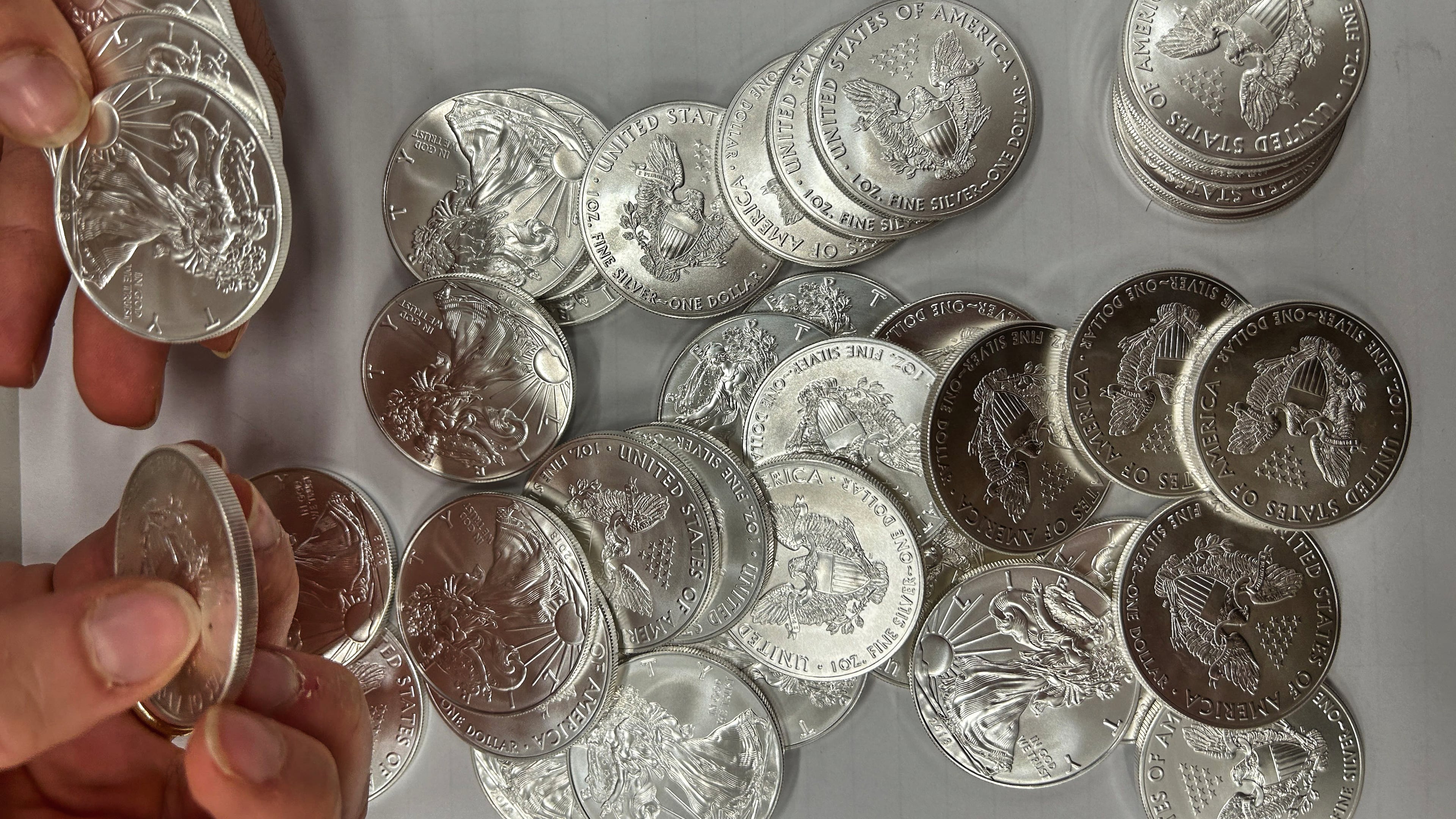 This handout photo released by Norwegian economic crime investigators on Thursday, Sept. 17, 2026, shows the U.S. "American Eagle" silver coins discovered by police in a van that was stopped after being driven "erratically" outside Oslo in April 2025. (Norwegian economic crime investigators via AP)