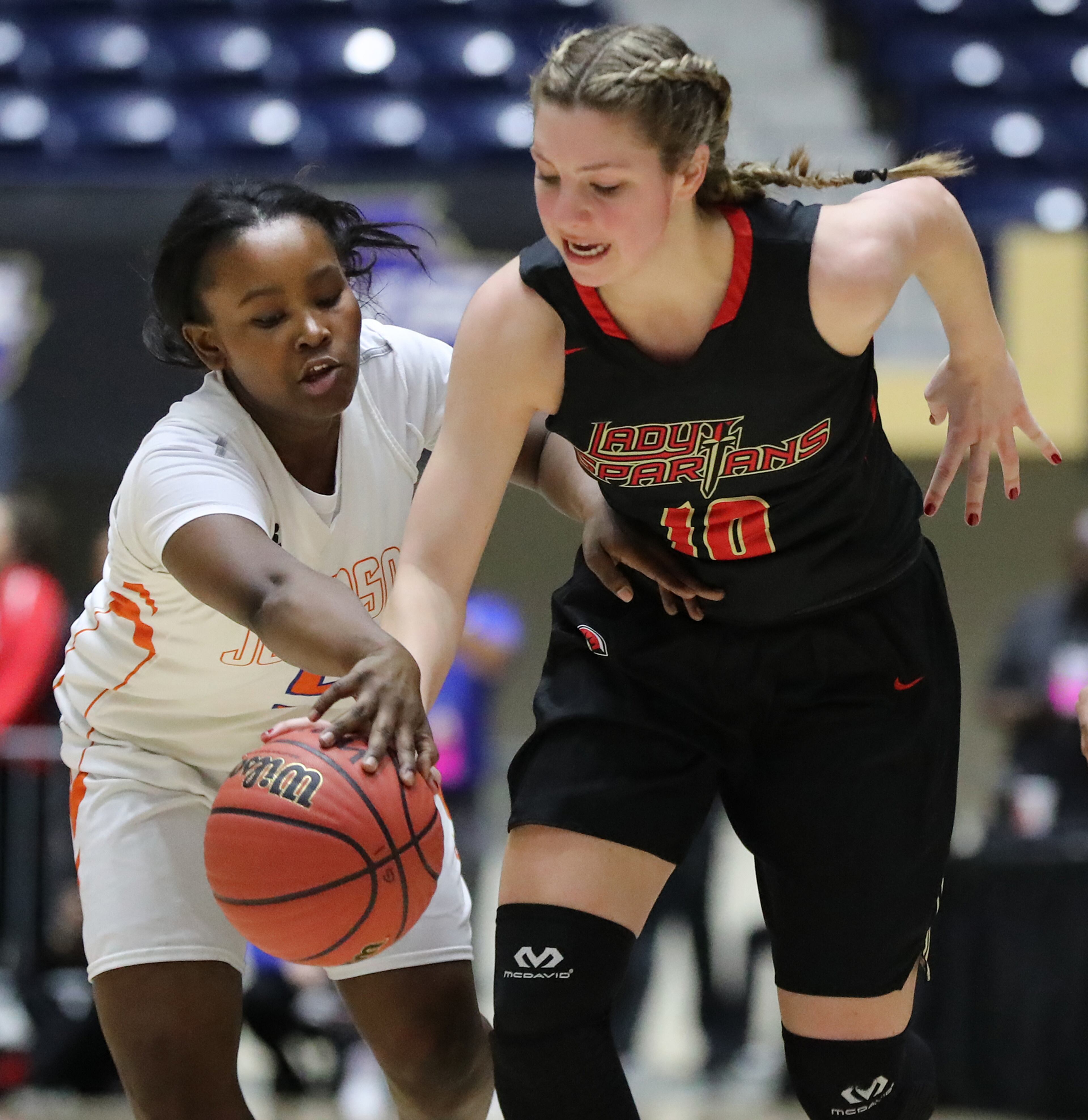 March 8, 2018 Macon: GAC center MaryMartha Turner and Johnson-Savannah guard Tianna Williams battle for the ball in their GHSA state basketball championship game on Thursday, March 8, 2018, in Macon. Curtis Compton/ccompton@ajc.com