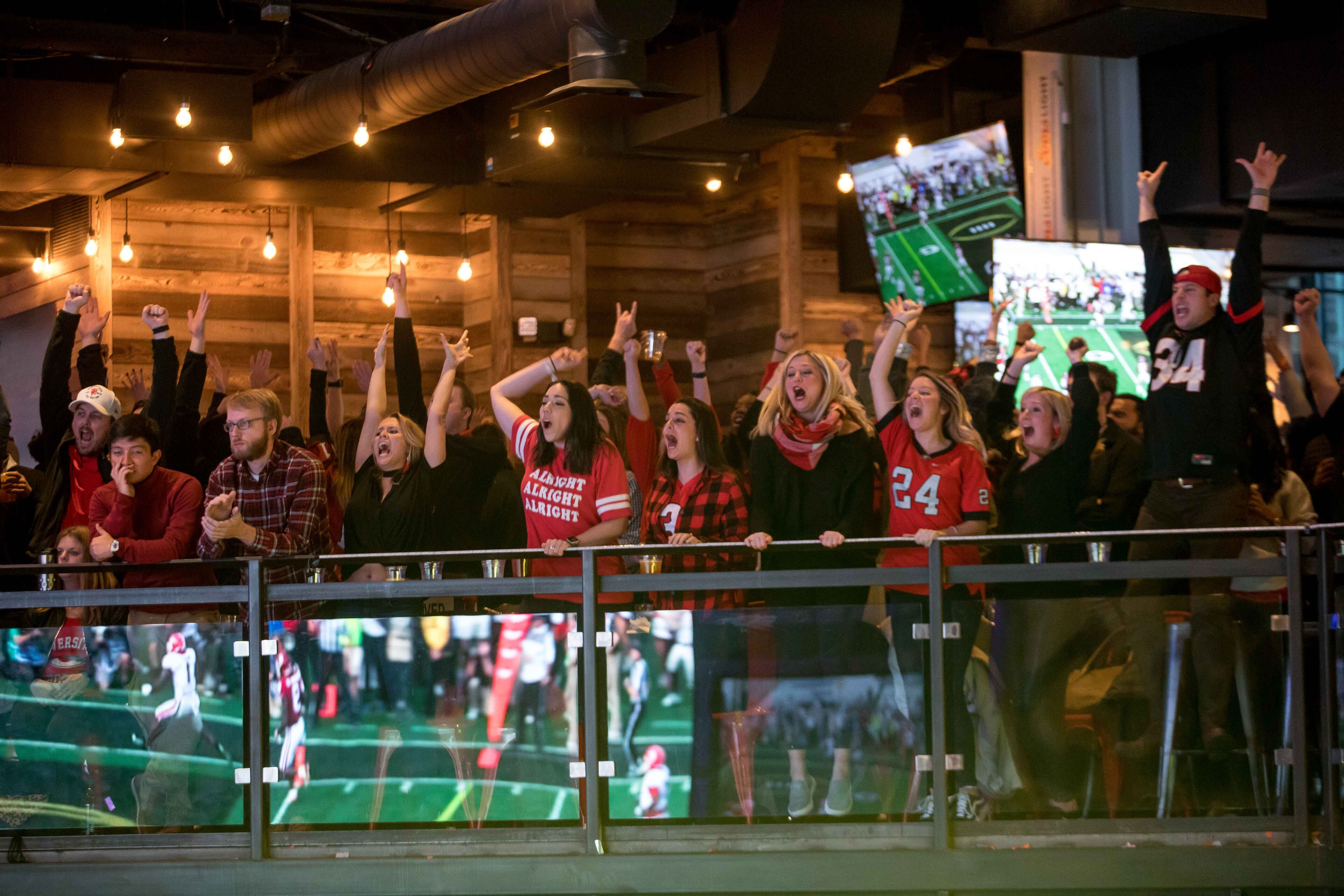 Georgia fans cheer as Sony Michel scores a touchdown against Oklahoma in the Rose Bowl, Monday, Jan. 1, 2018, in Atlanta. BRANDEN CAMP/SPECIAL