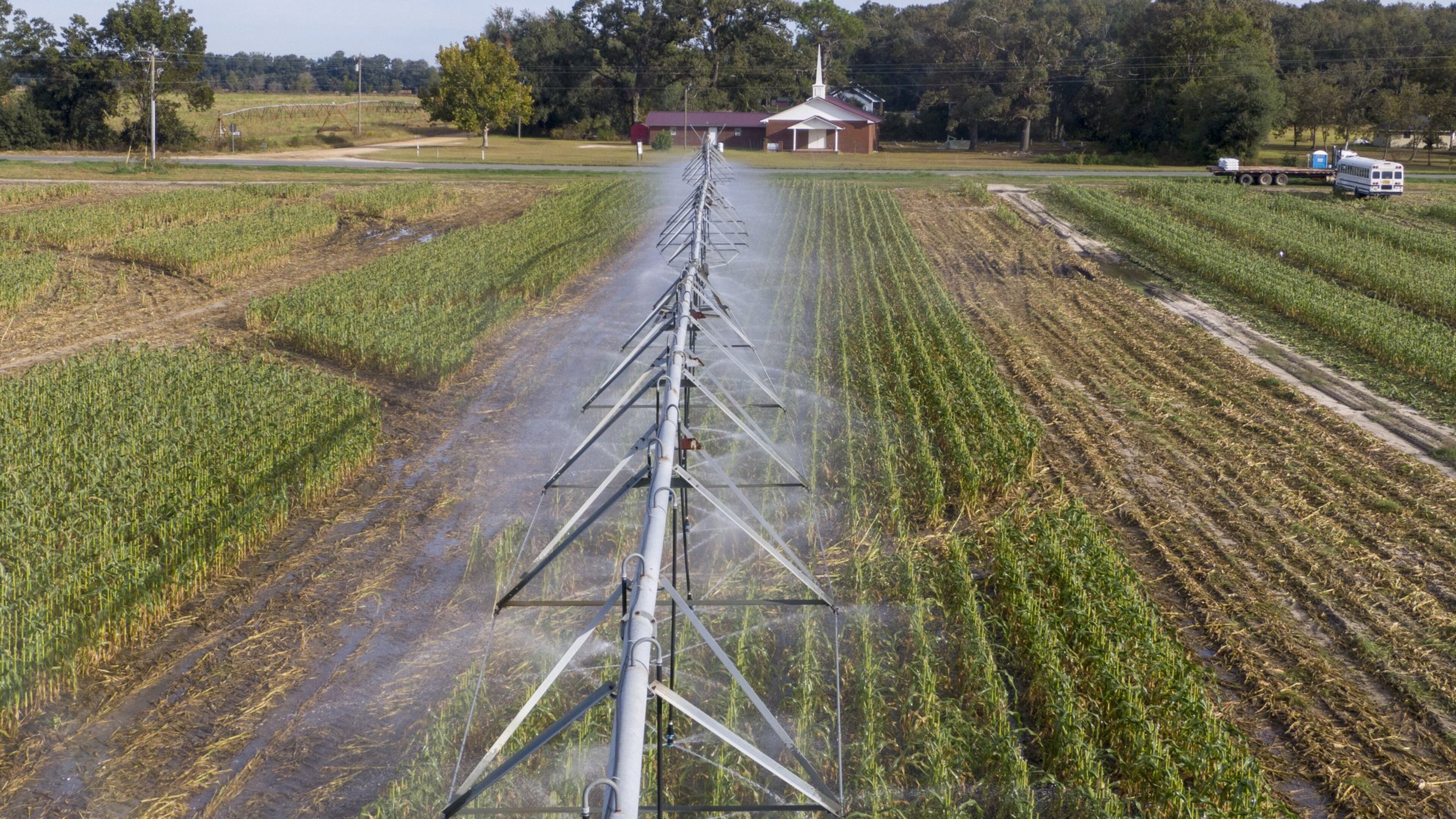 An irrigation sprinkler system waters crops at Worsham Farms near Vada on Oct. 17, 2019. (Hyosub Shin / Hyosub.Shin@ajc.com)