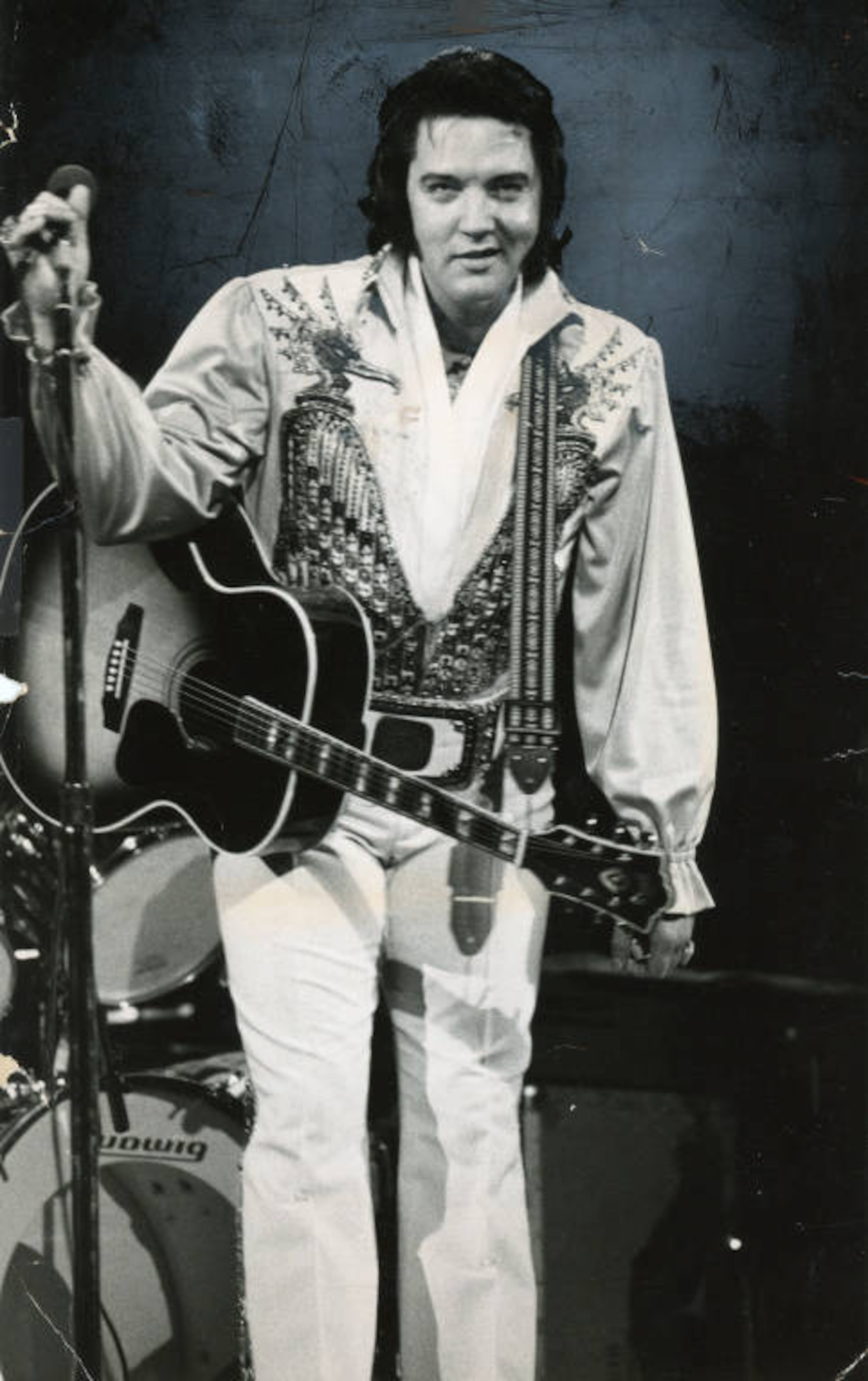 Elvis Presley, holding guitar, performing at the Omni, Atlanta, Georgia, June 4, 1976. Joe McTyre/AJC